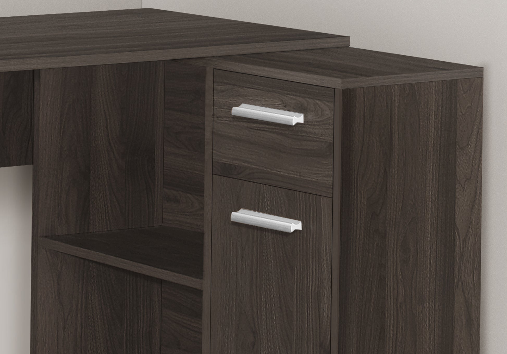 Dark wood corner desk with silver drawer pulls and open shelf