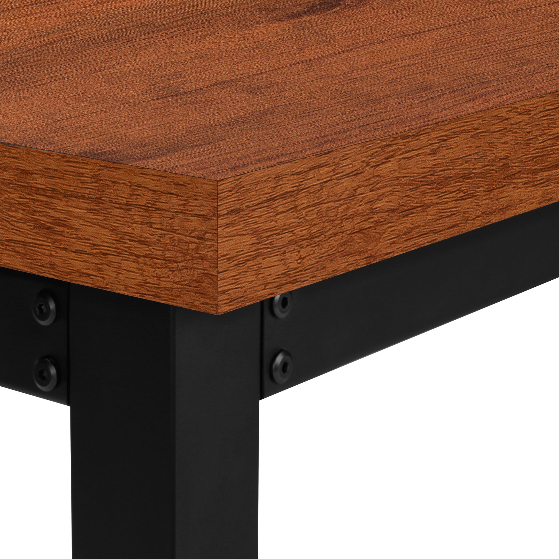 Closeup of a rich brown wood desk surface with visible grain texture and black metal legs