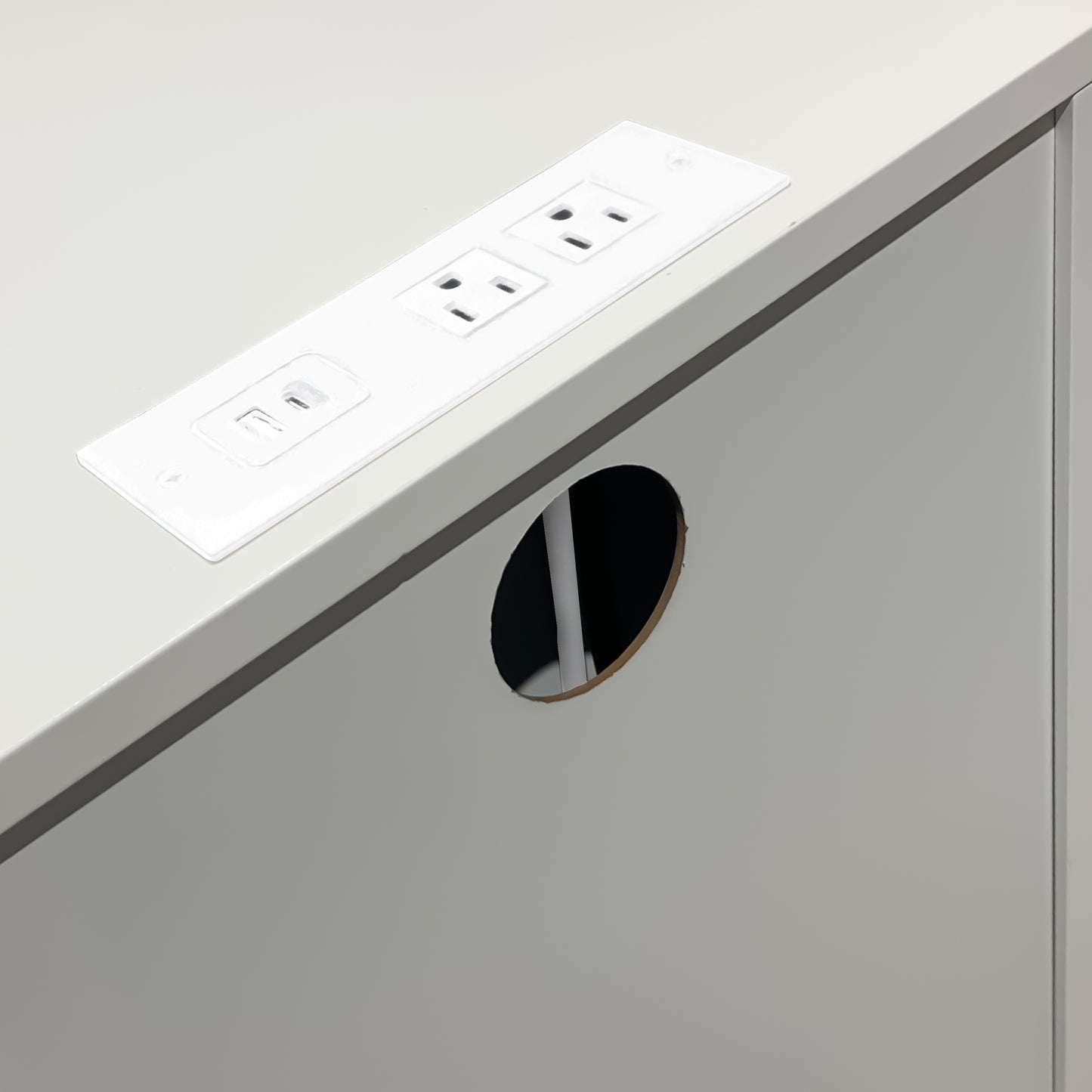 White recessed desk power grommet with two AC outlets and one USBA port