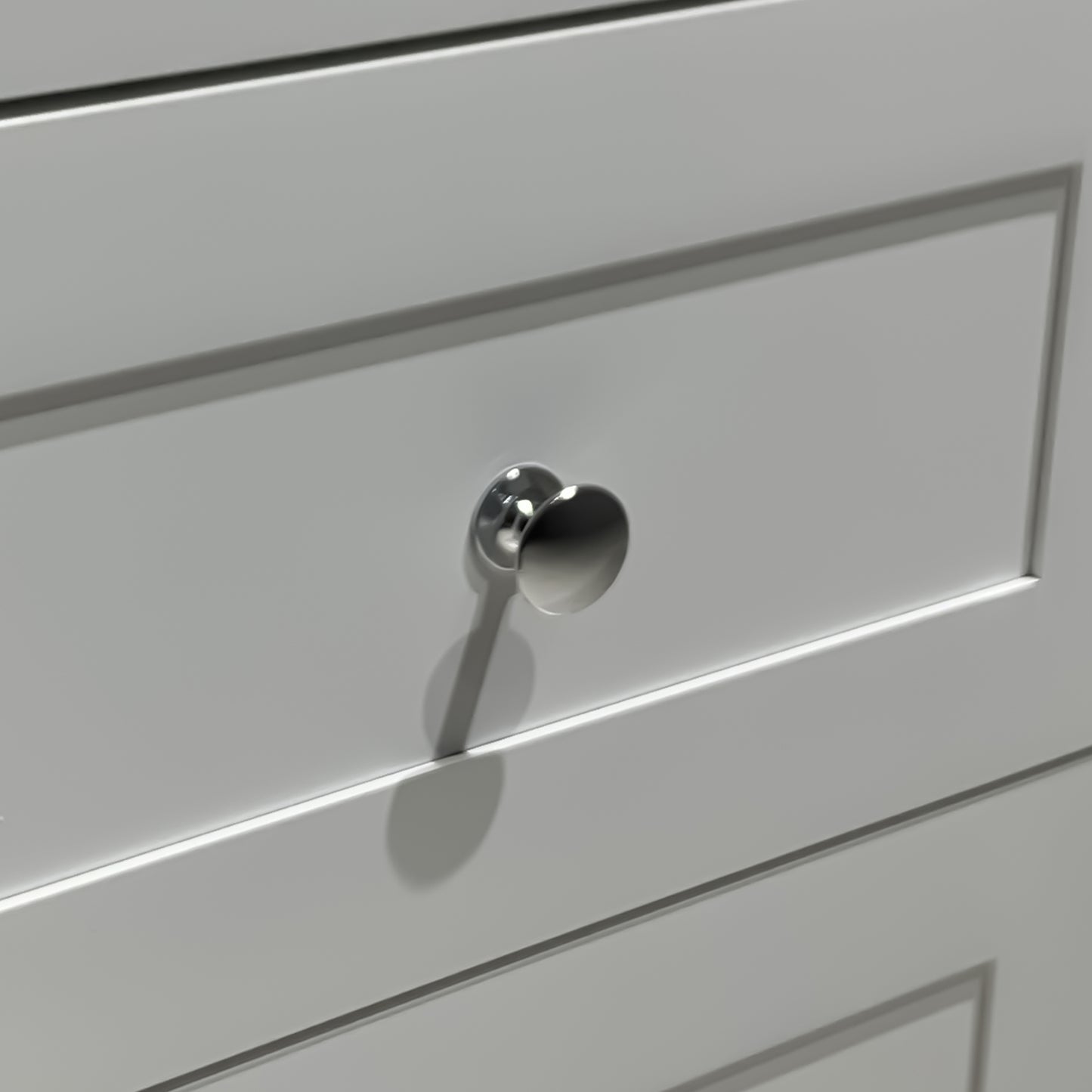 Brushed nickel cabinet knob with a modern round design