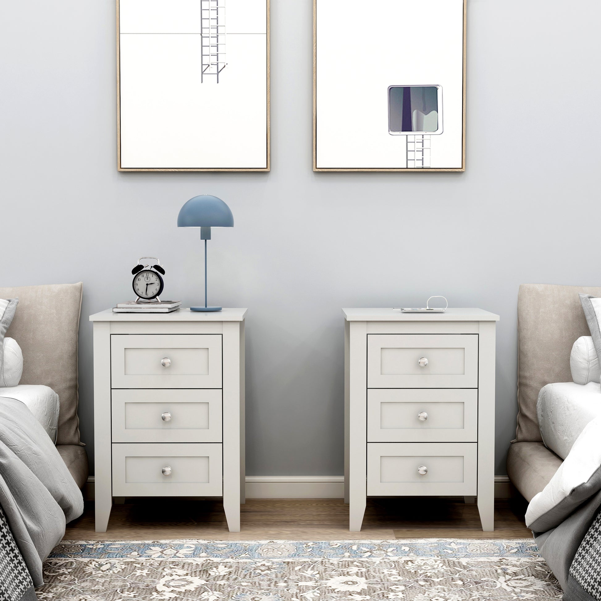 White threedrawer bedside table with silver knobs