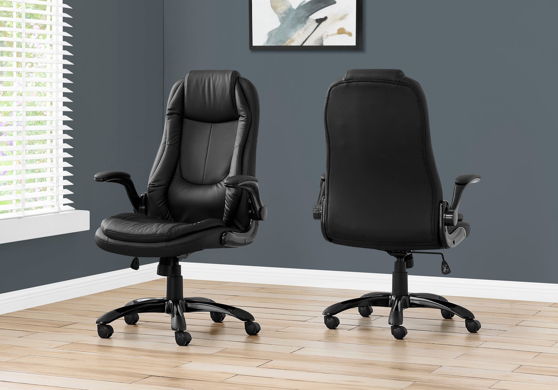 Black executive chair with padded seat and back ideal for office use