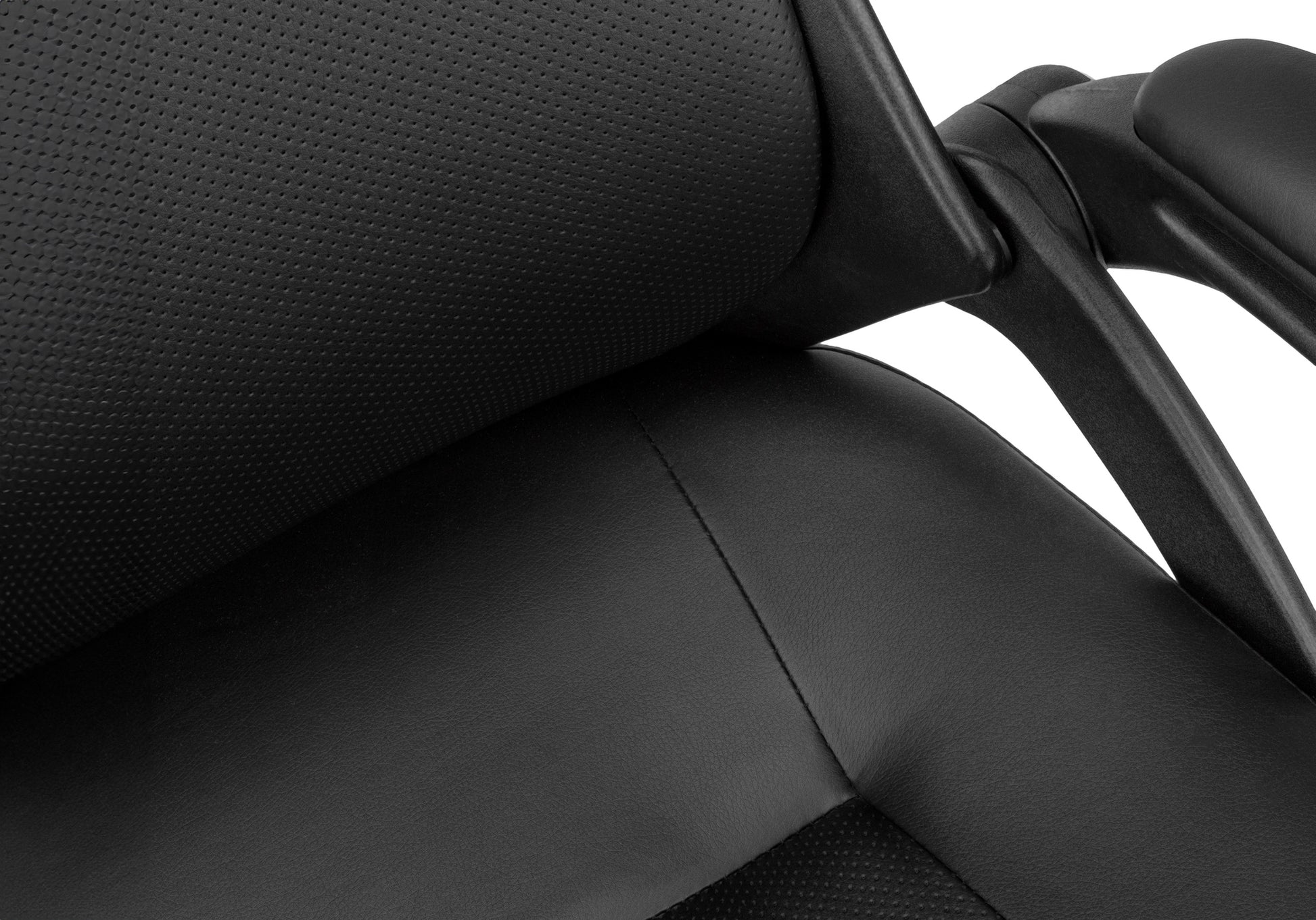 Closeup of black perforated leather office chair seat with stitched detailing for comfort