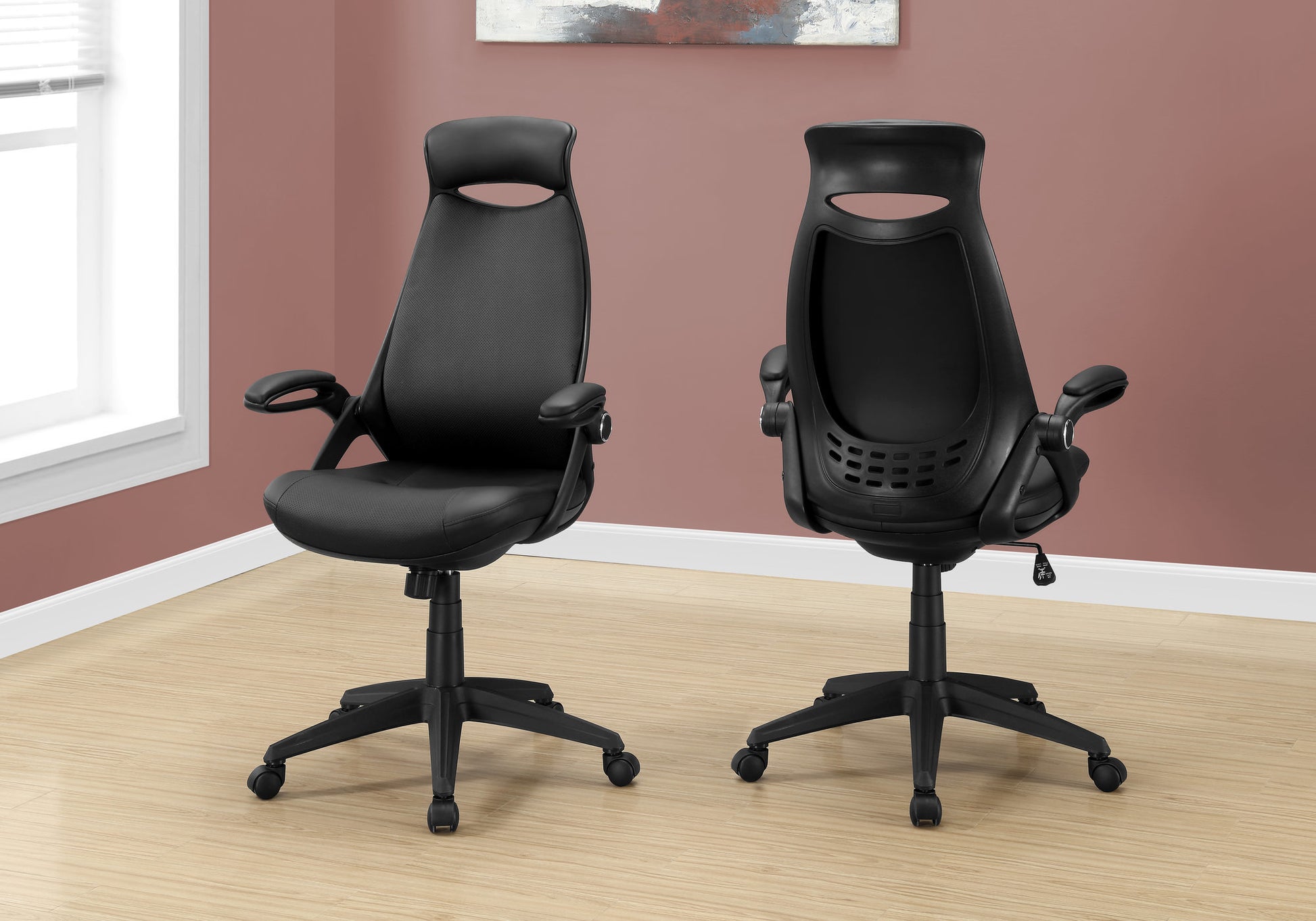 Black ergonomic office chair with faux leather upholstery and lumbar support