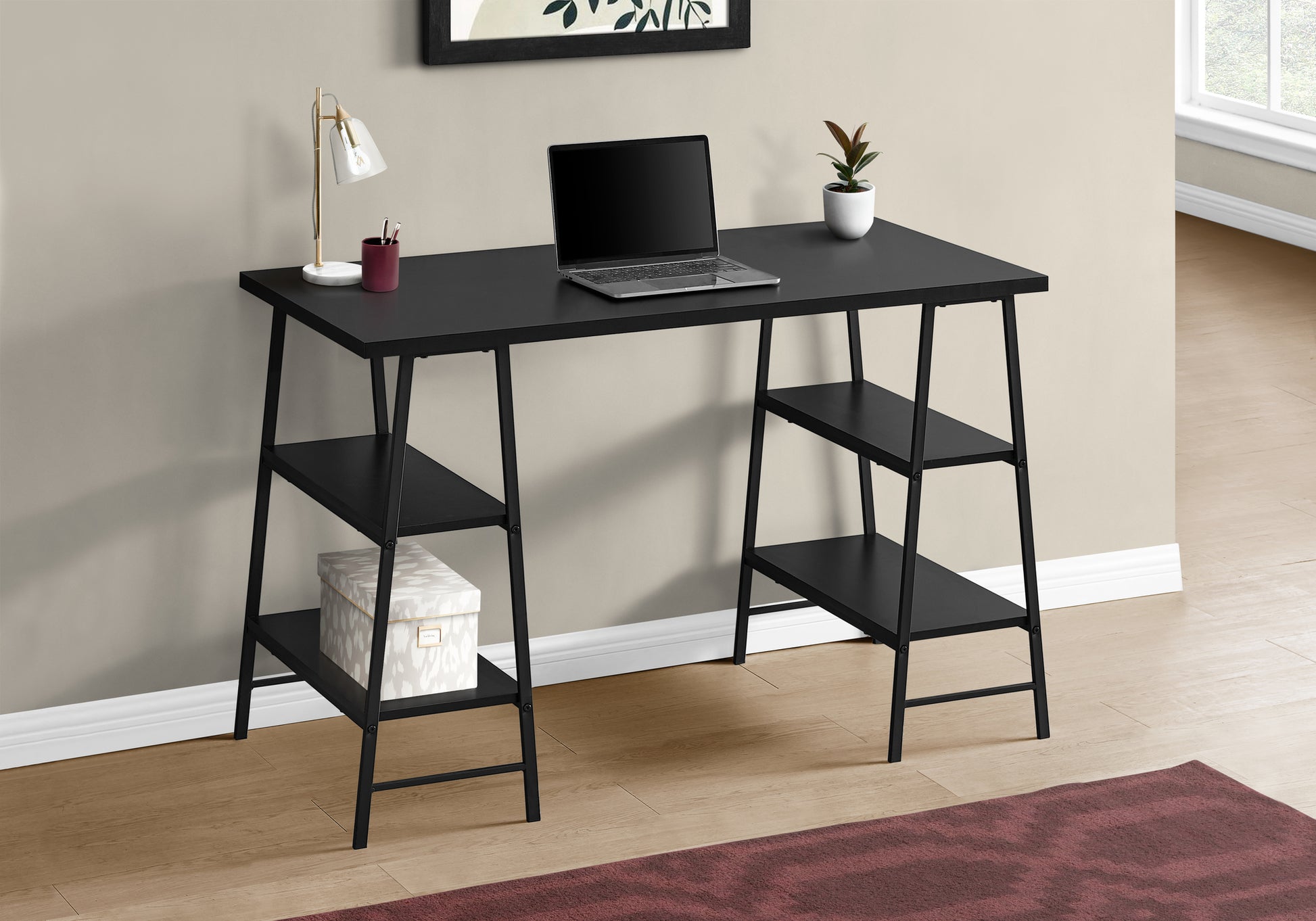 Modern black computer desk with shelves and laptop for home office