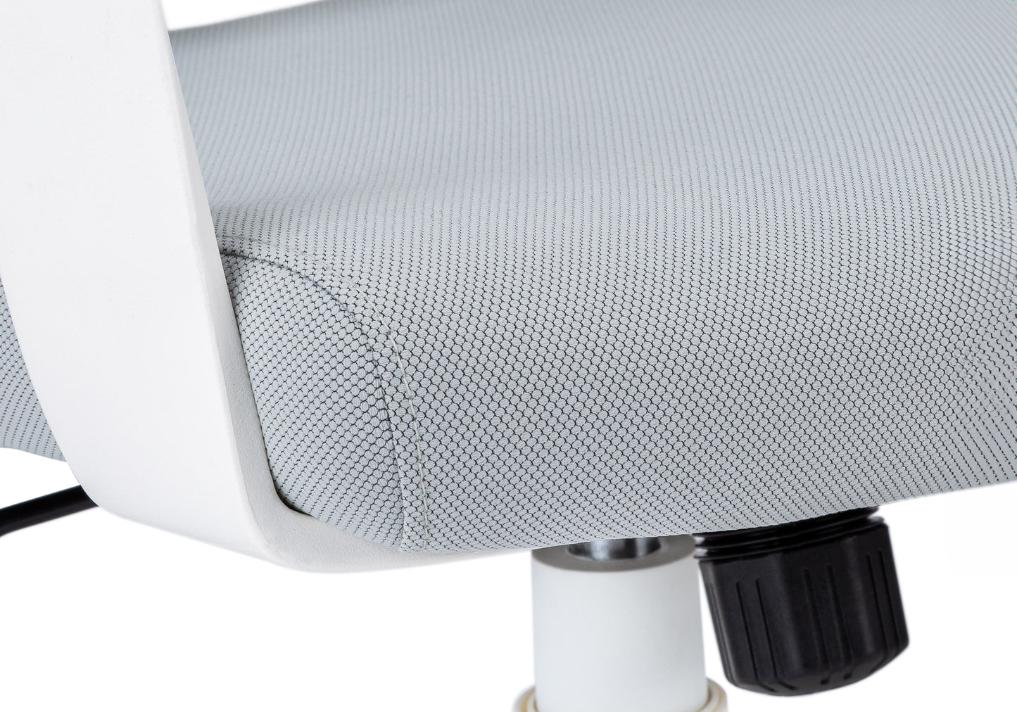 Closeup of a light grey mesh fabric on an ergonomic office chair seat