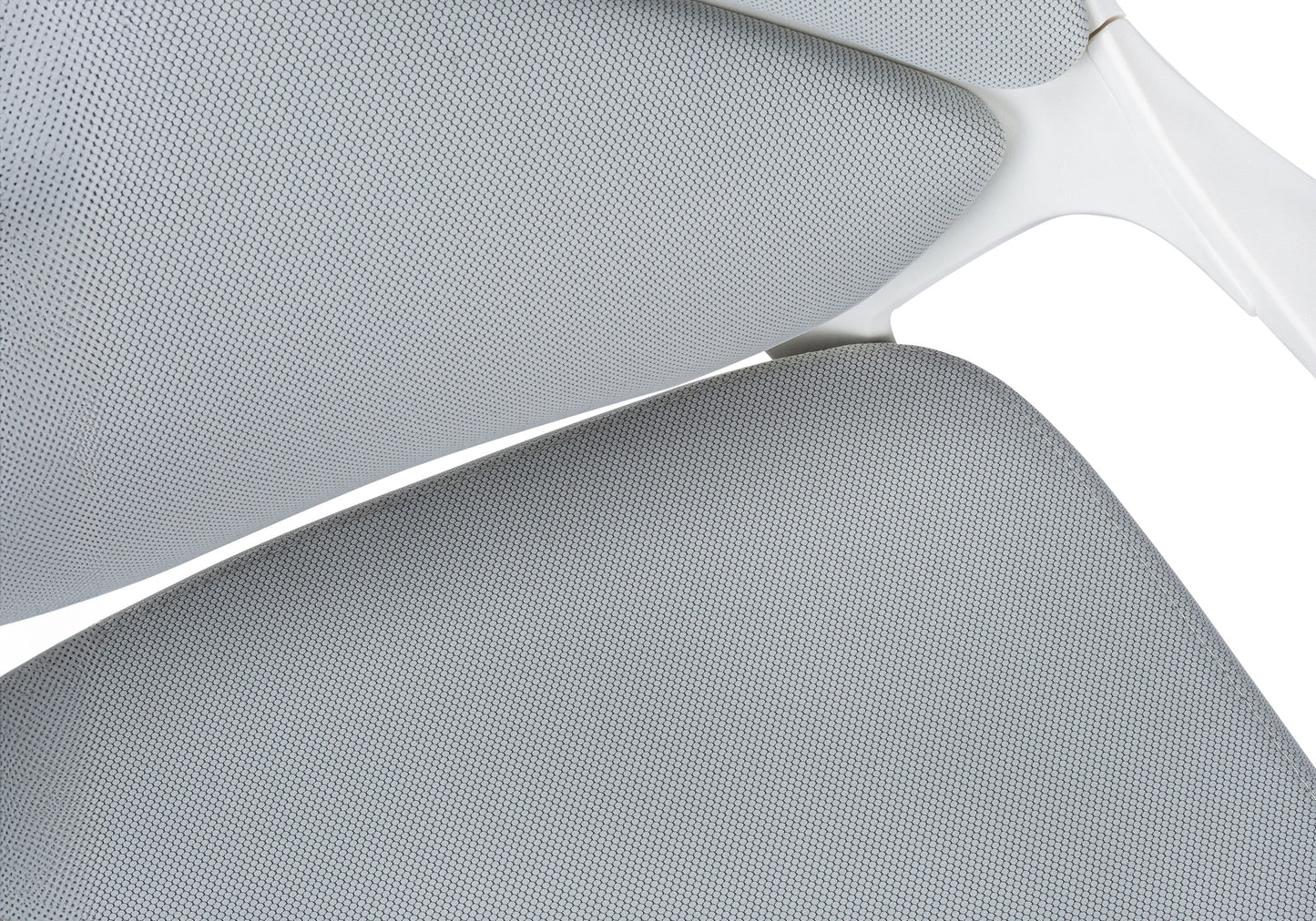 Closeup of grey mesh fabric on modern ergonomic office chair seat