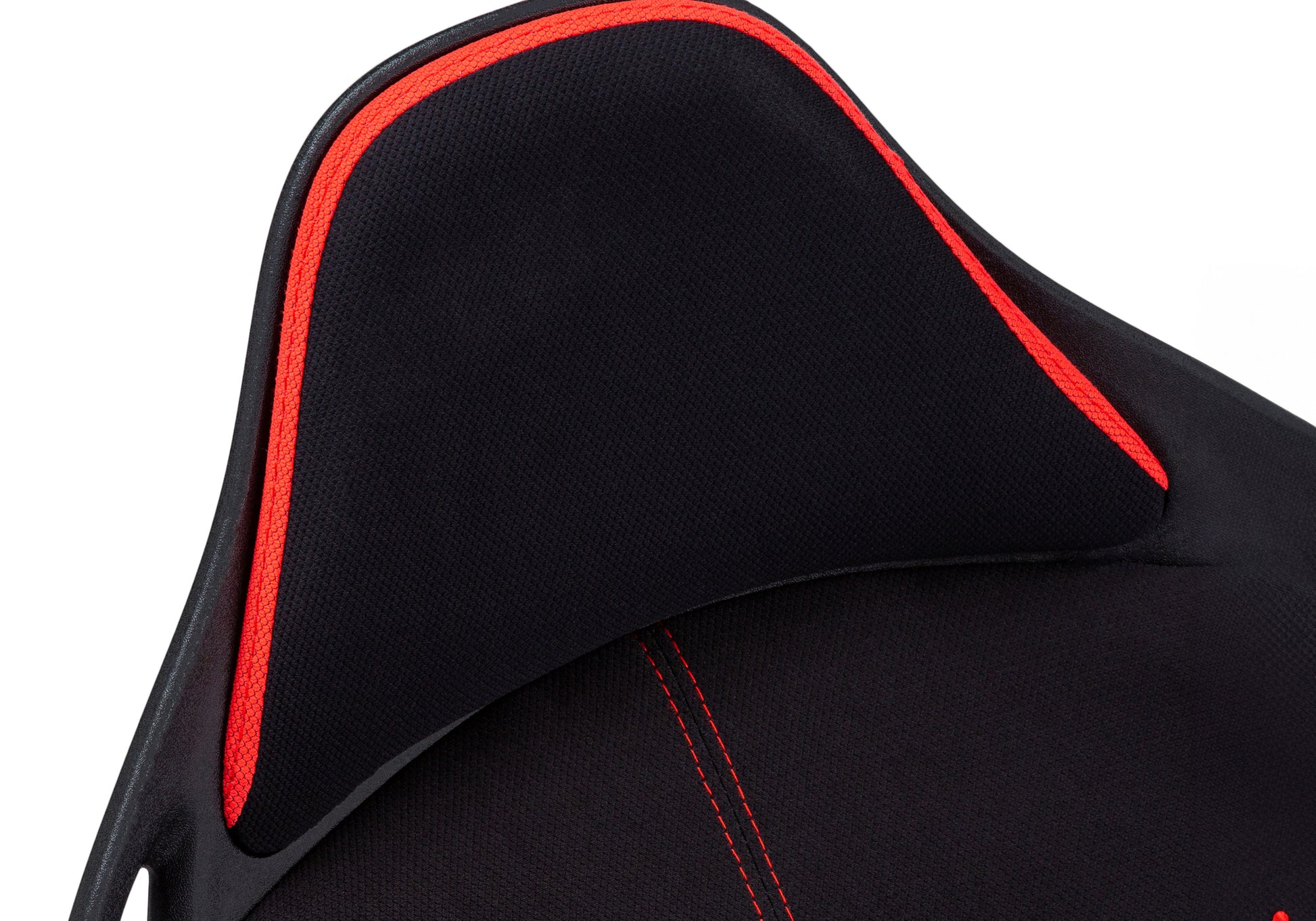 Closeup of black ergonomic gaming chair with red trim and stitching