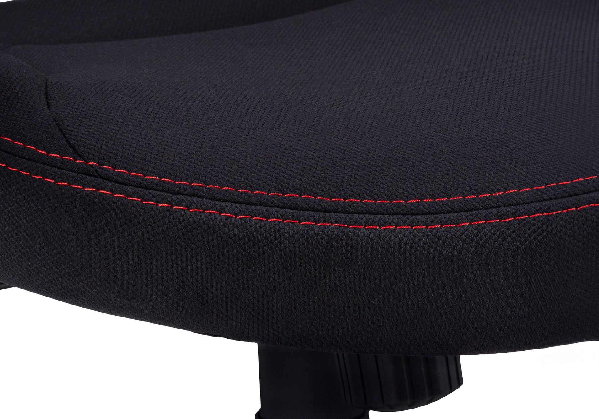 Black textured fabric seat cushion with contrasting red stitching on gaming chair