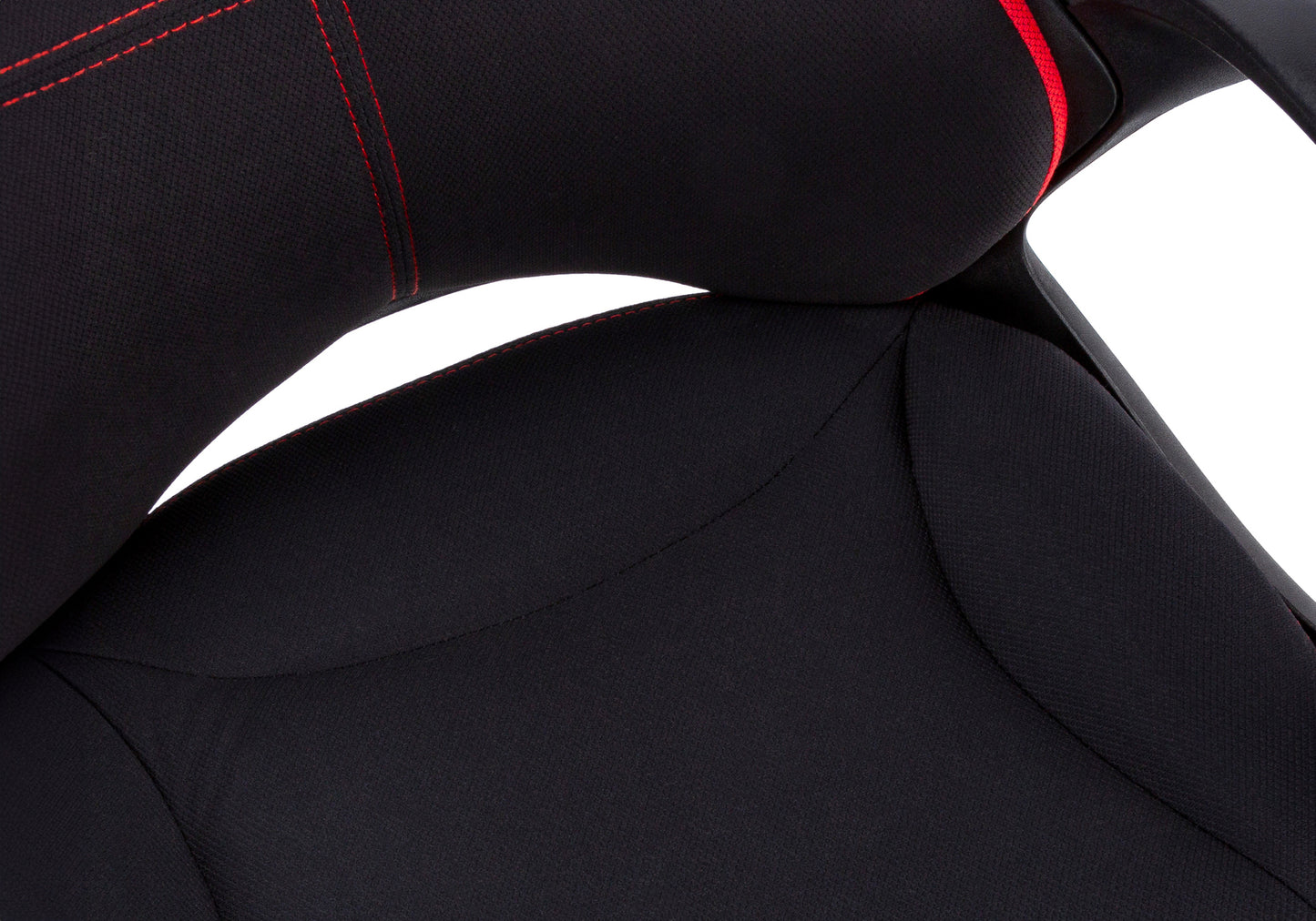 Closeup of black gaming chair seat with red stitching detail