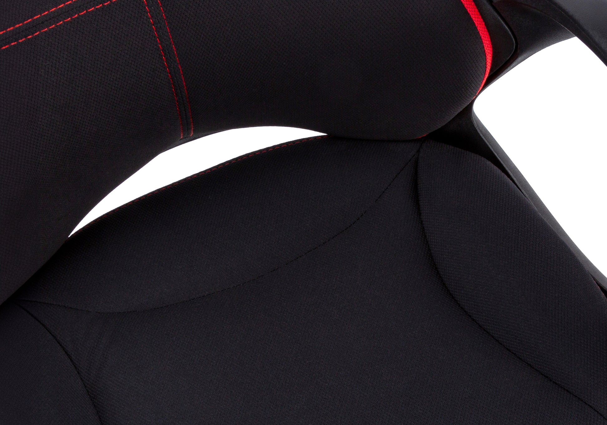 Closeup of black gaming chair seat with red stitching detail
