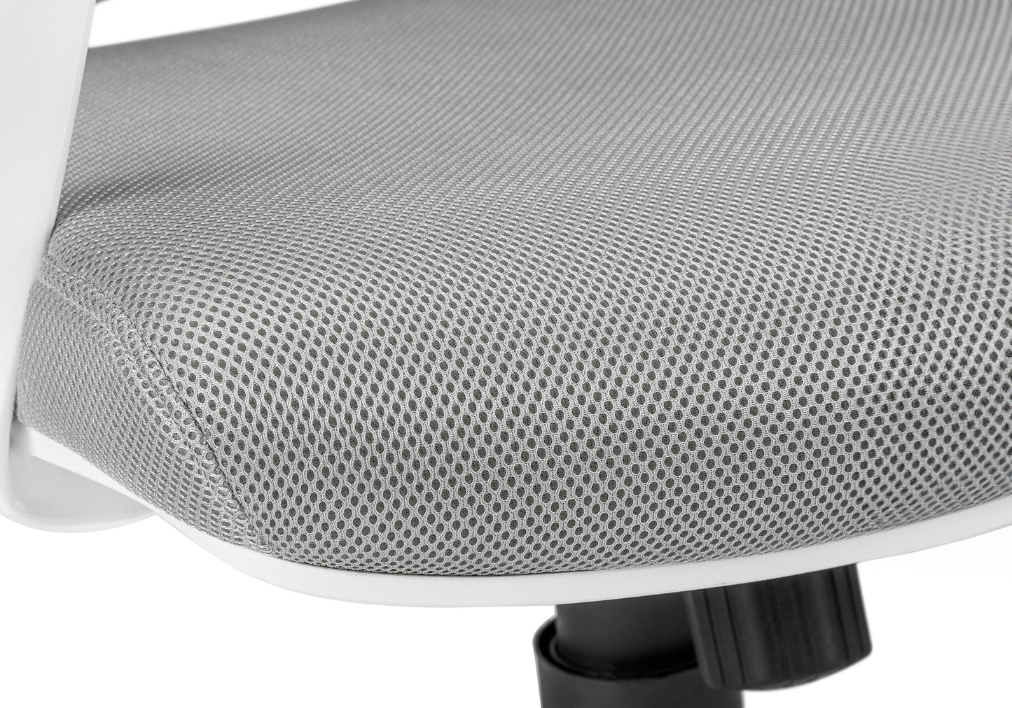Closeup of a grey mesh office chair seat with white trim and a black base