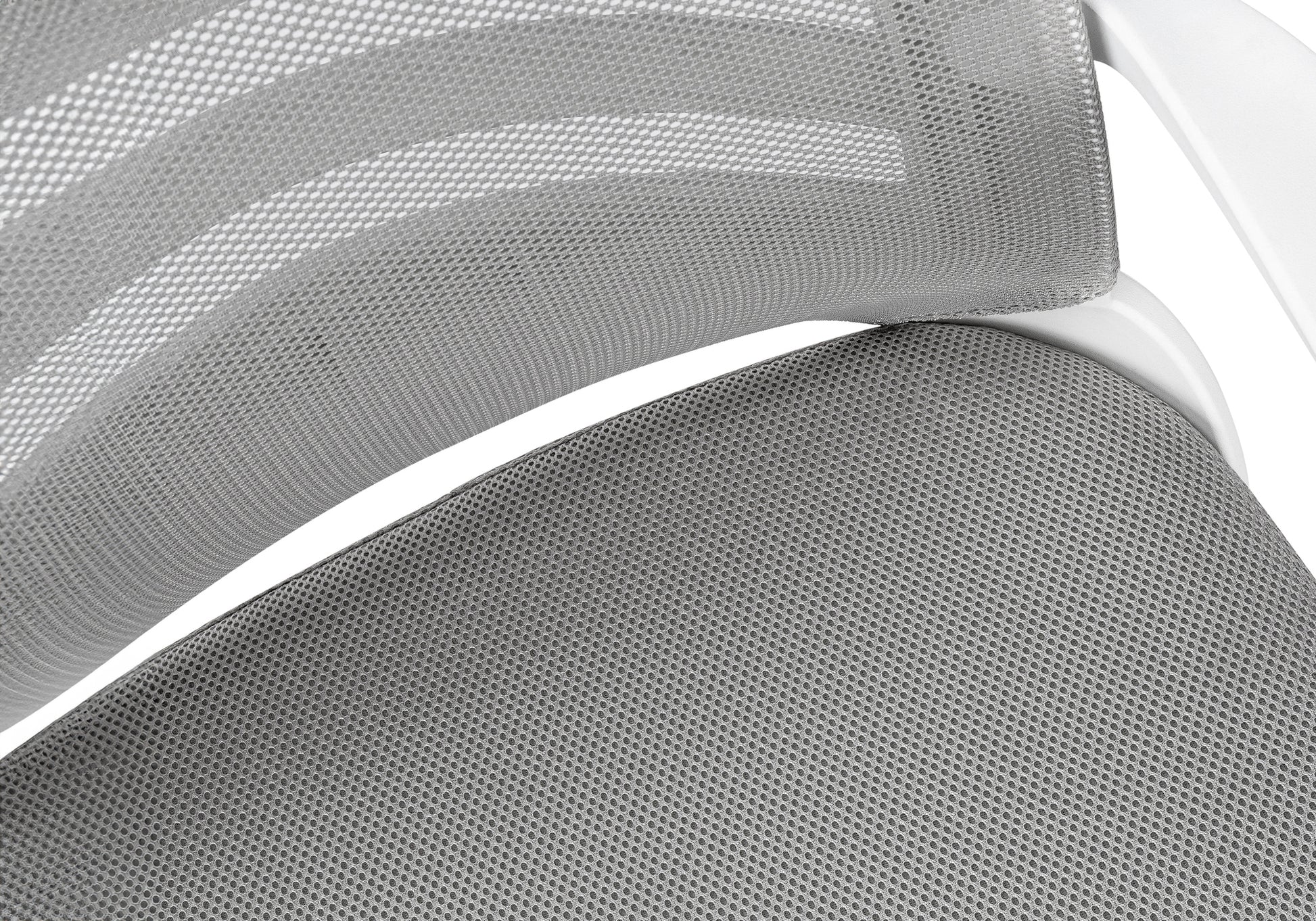 Closeup of gray mesh fabric on an ergonomic office chair back and seat