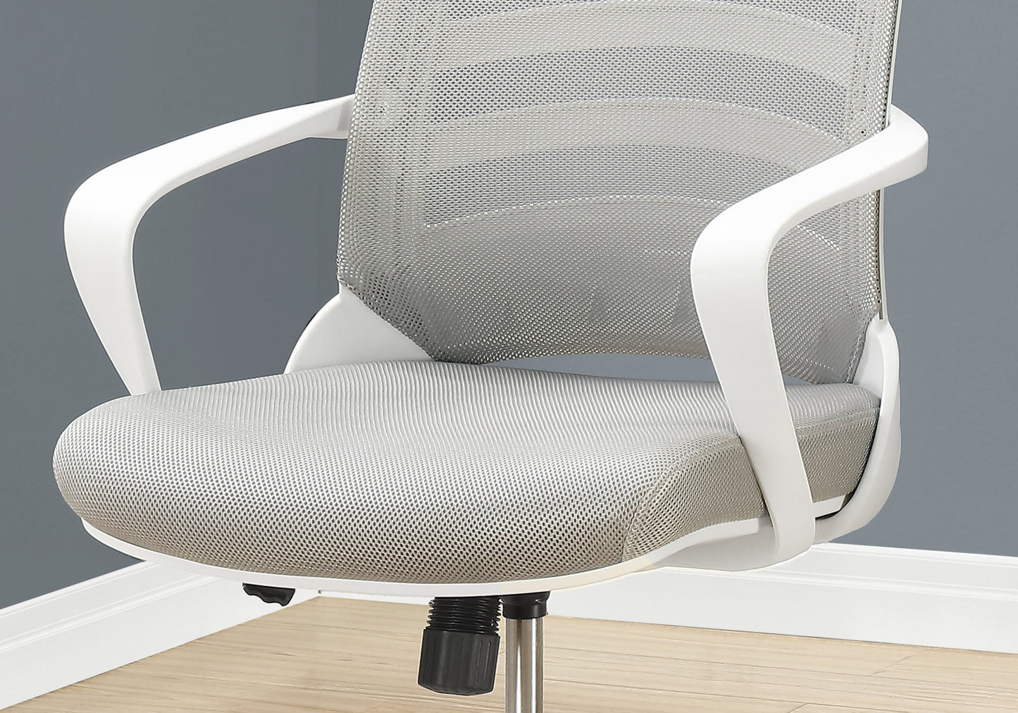Modern grey mesh office chair with white ergonomic armrests for comfortable seating