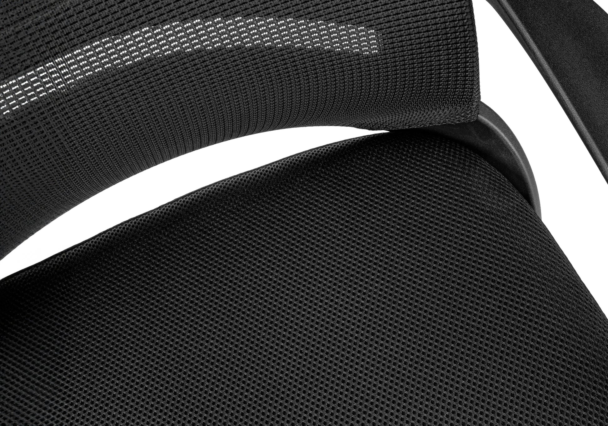 Black mesh fabric on office chair seat showing hexagonal pattern