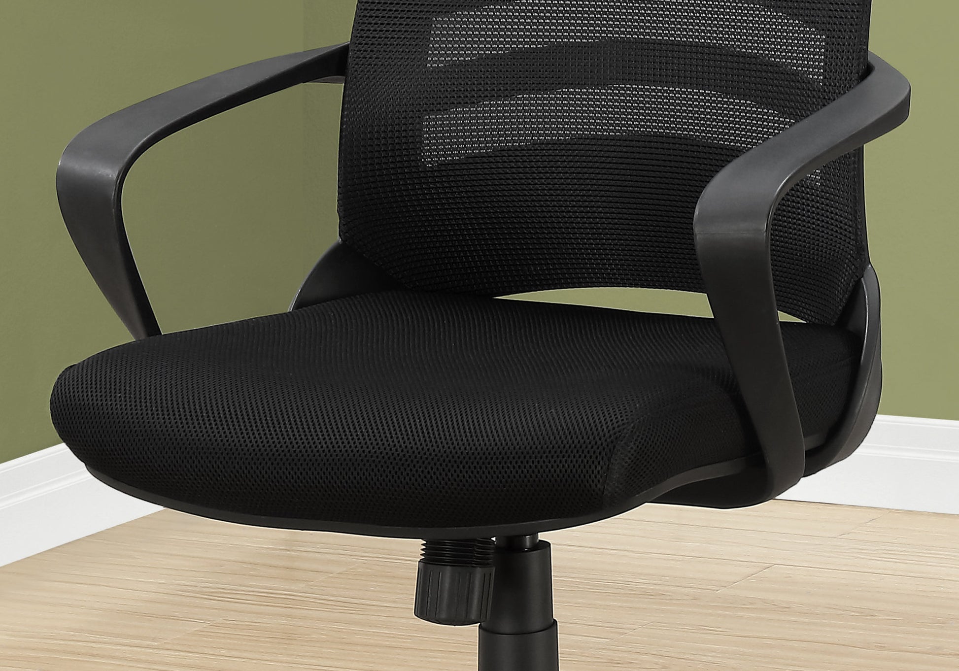 Black mesh office chair with padded seat and curved armrests for comfort
