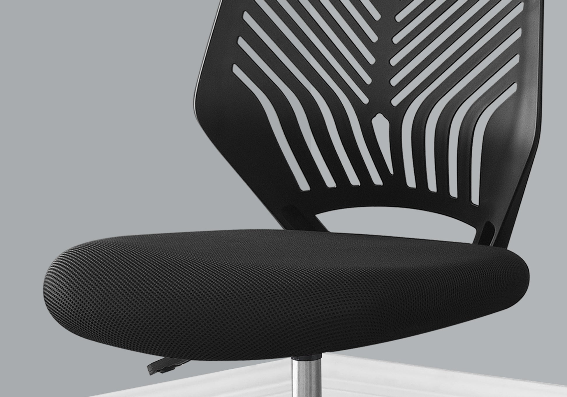 Black mesh office chair seat with ergonomic design and curved backrest