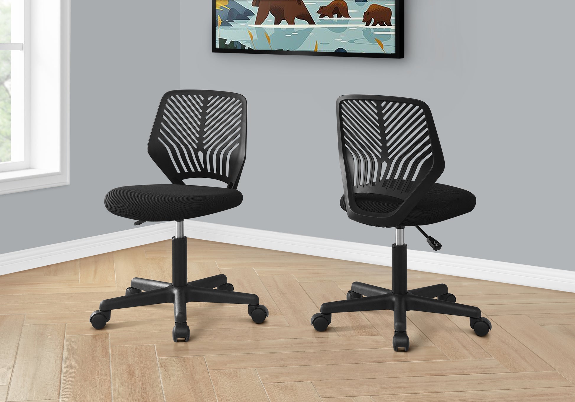 Black mesh ergonomic office chair with a sleek design ideal for home workspaces