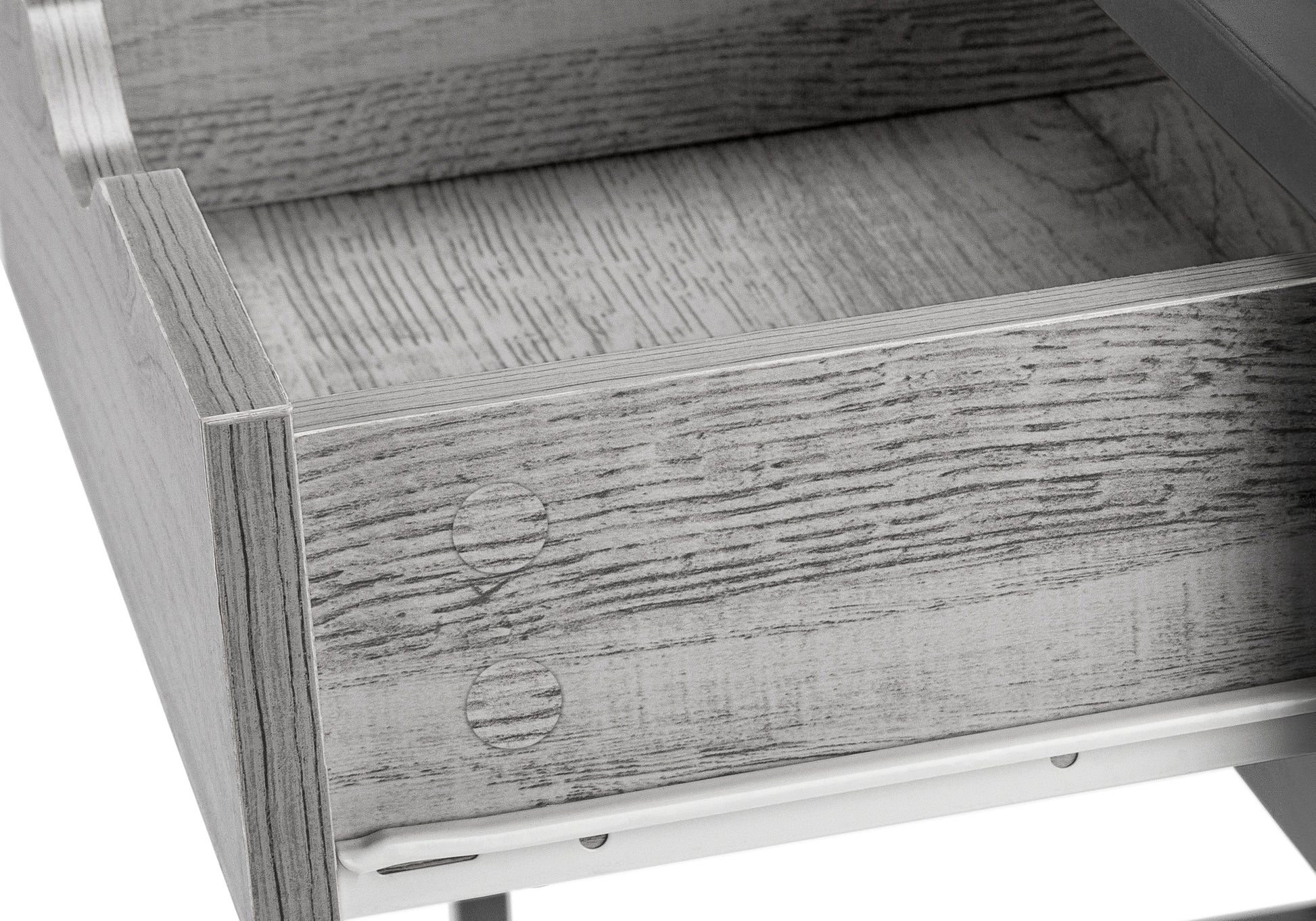 Closeup of a grey woodgrain drawer interior with a white metal slide mechanism visible