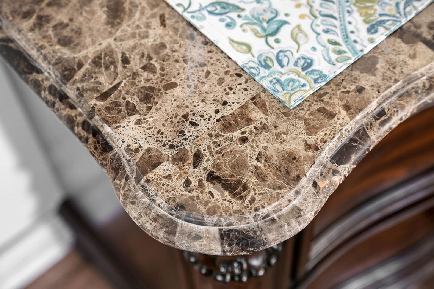 Brown marble countertop with ornate edging