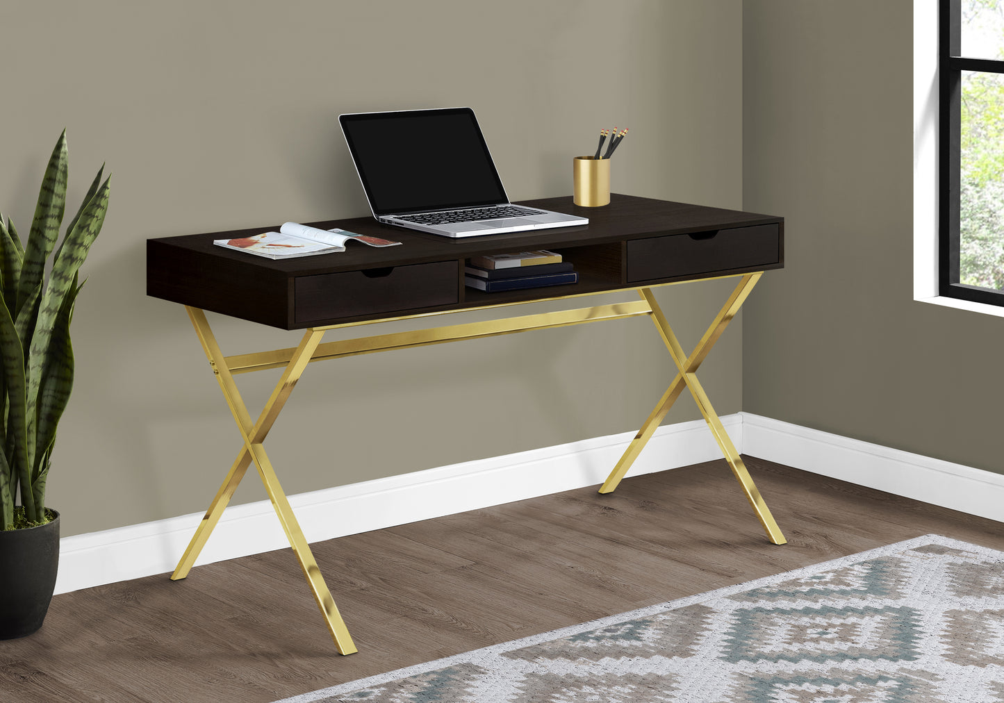 Dark wood modern desk with gold Xframe legs and laptop