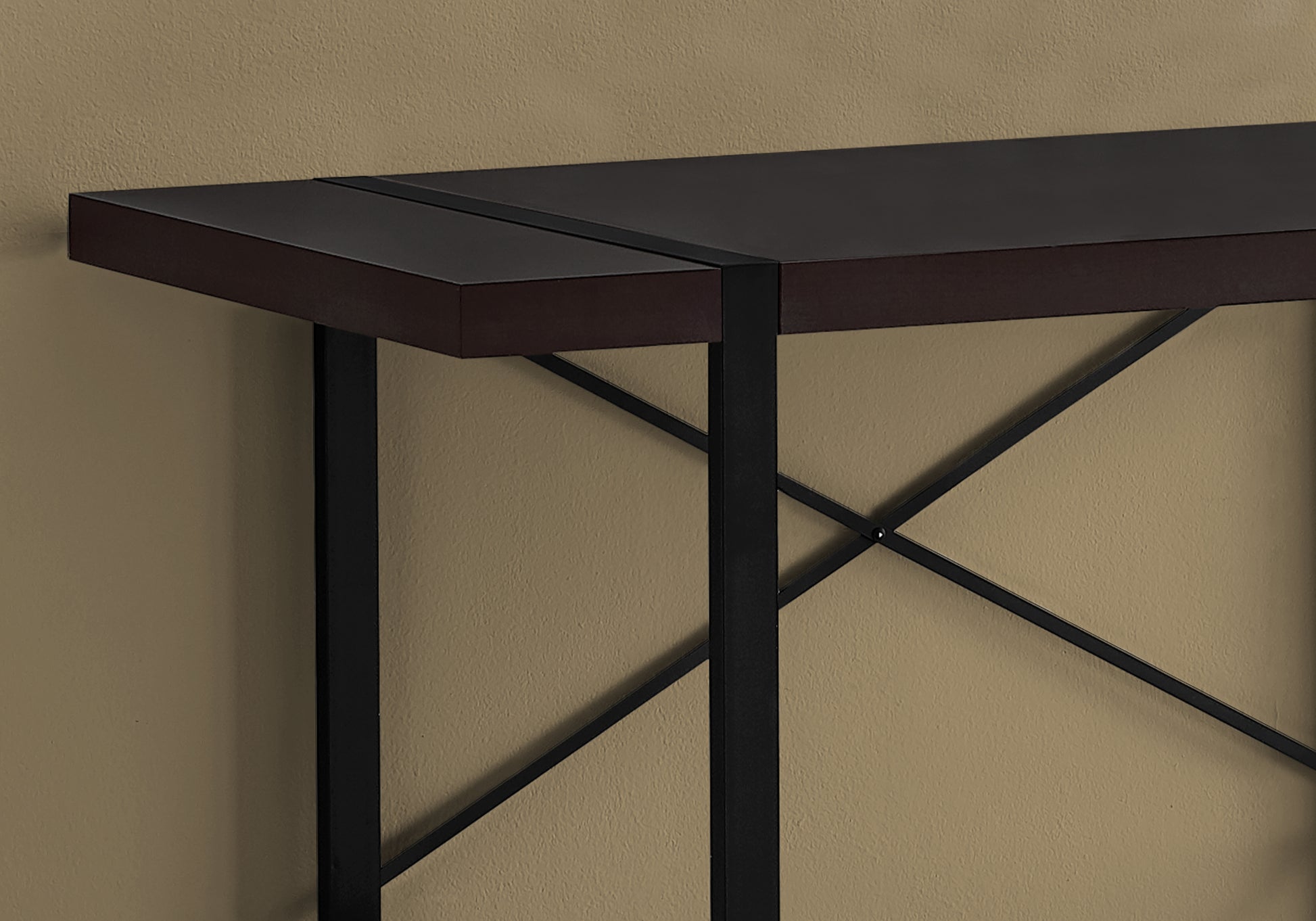 Dark brown entryway console with black metal legs and Xframe detailing