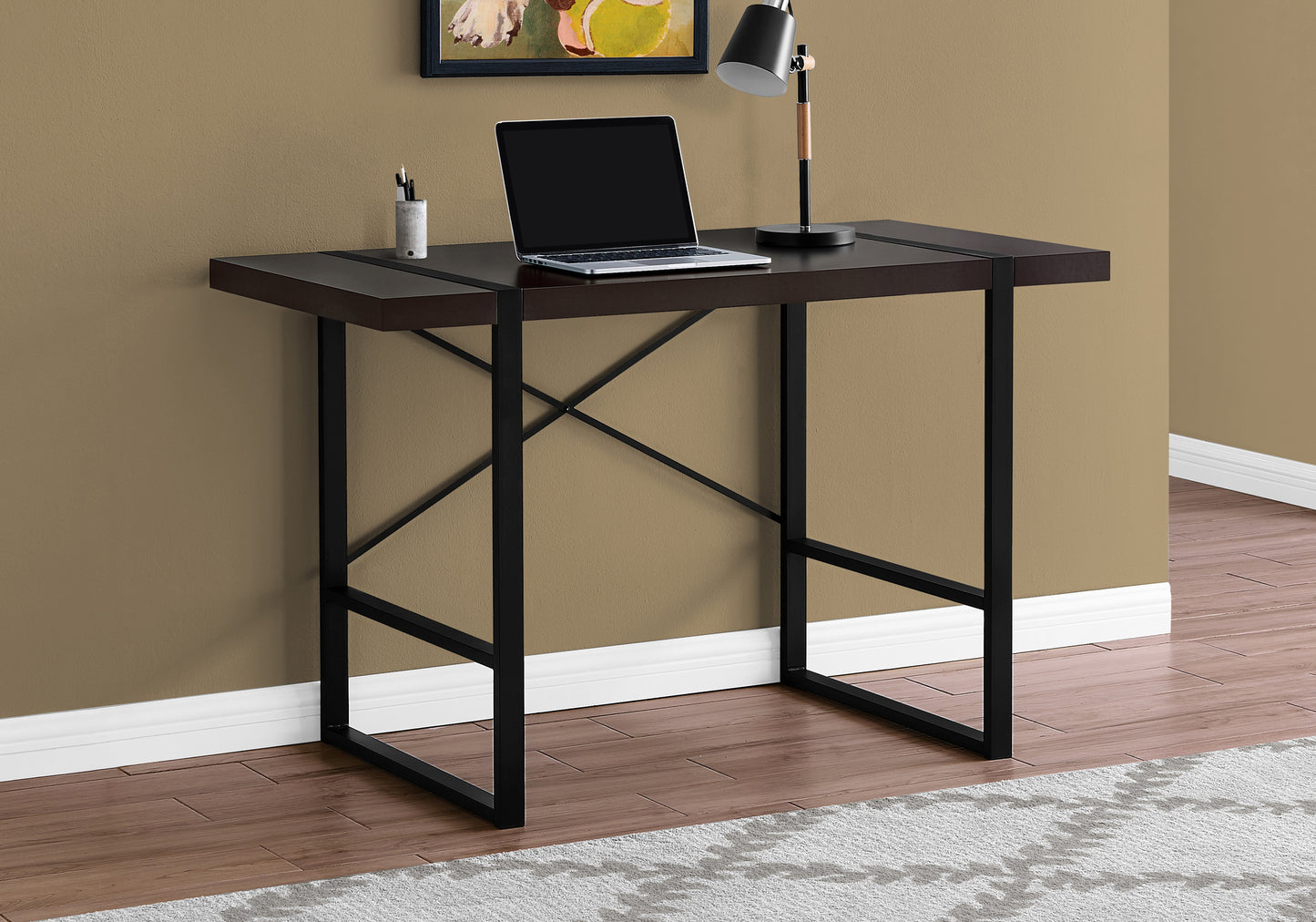Dark brown modern desk with black metal frame and laptop