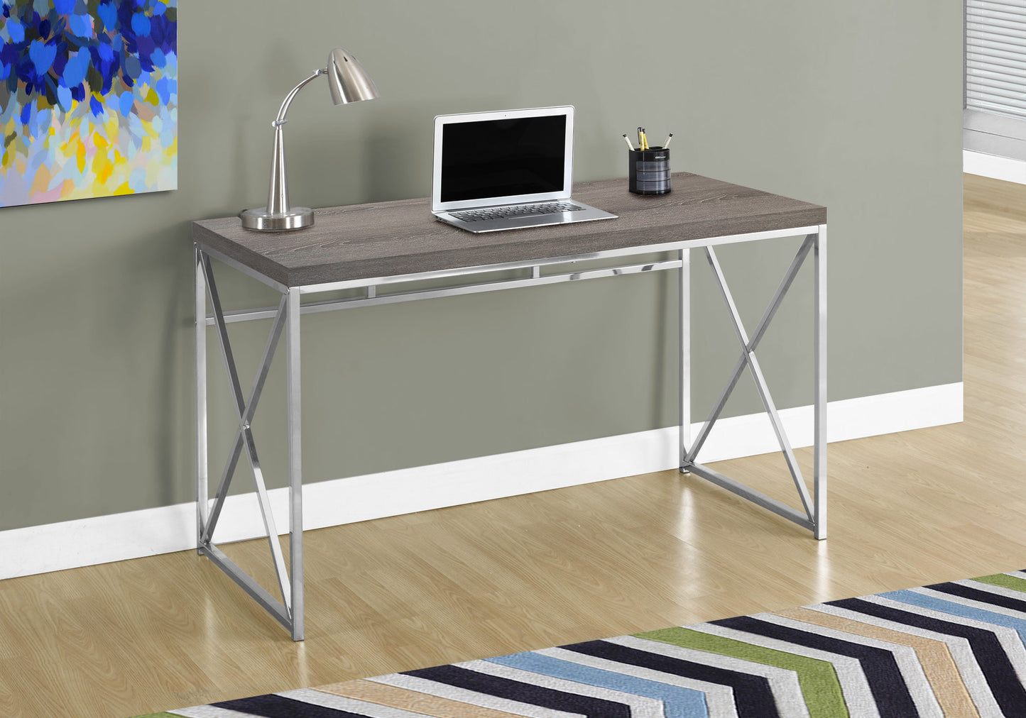 Modern gray wood grain desk with a silver Xframe base ideal for home offices