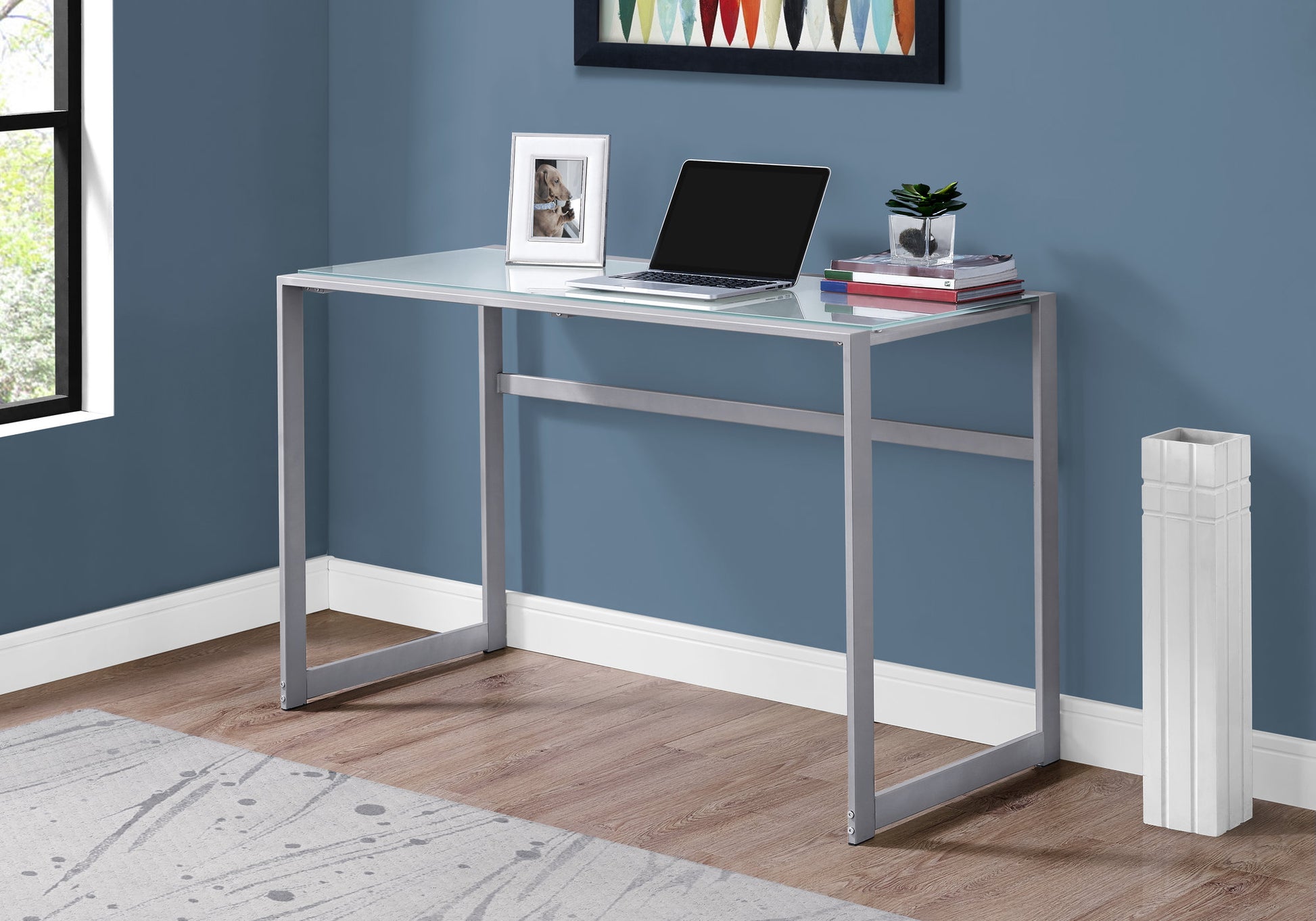 Sleek modern glass top desk with silver metal frame perfect for small spaces