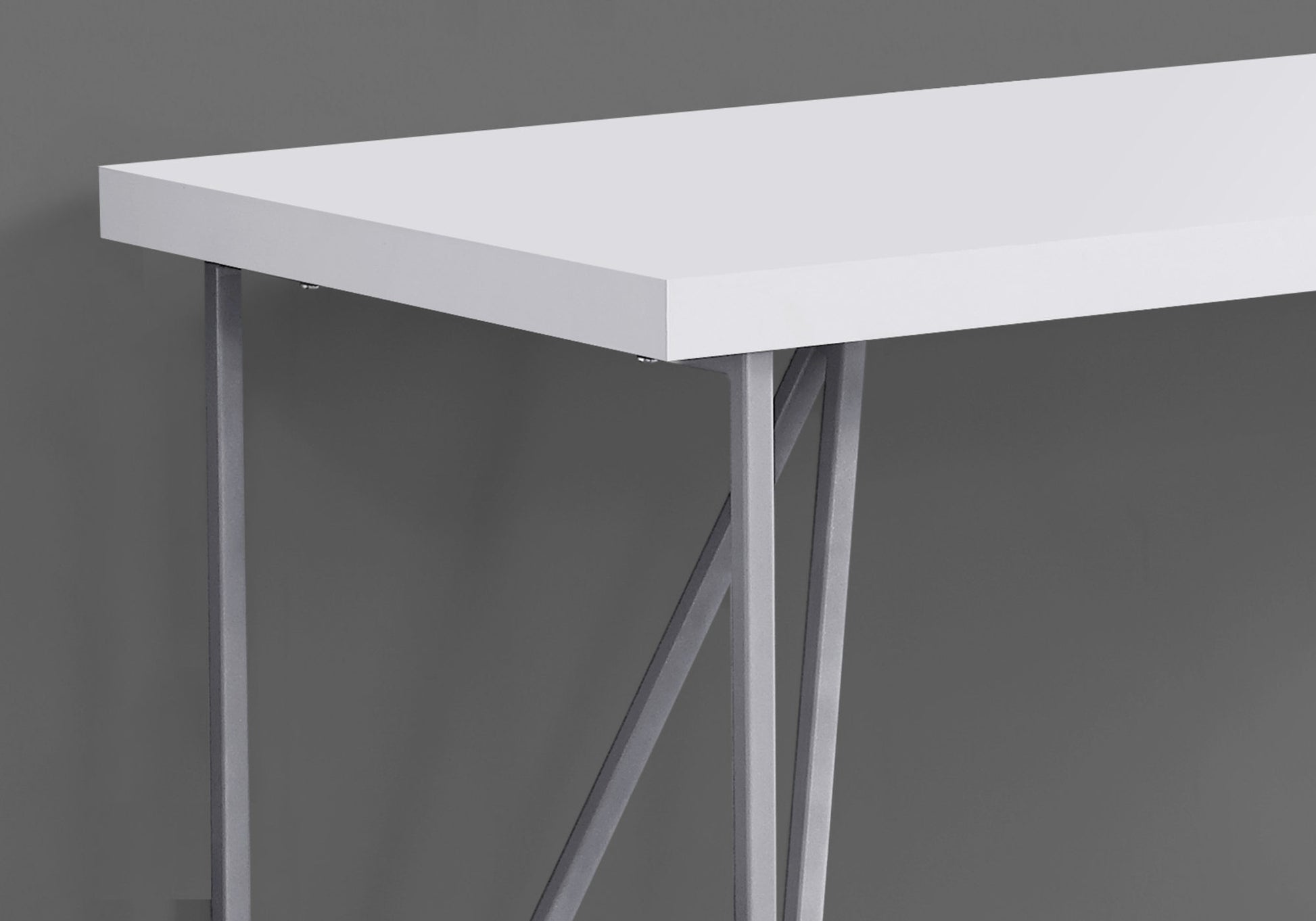 White modern console table with silver geometric legs for entryway decor