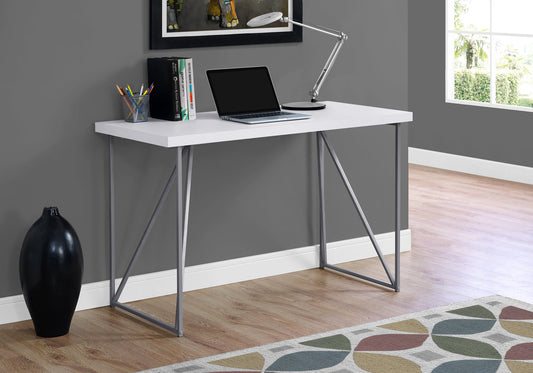 White modern writing desk with metal legs and laptop for home office