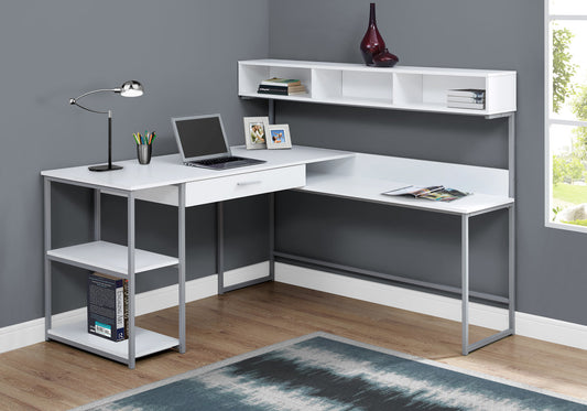 White lshaped computer desk with silver metal frame and open shelving