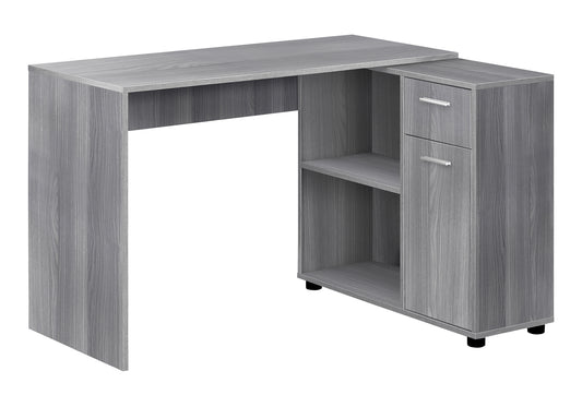 Gray Lshaped desk with two drawers and open shelves perfect for home office