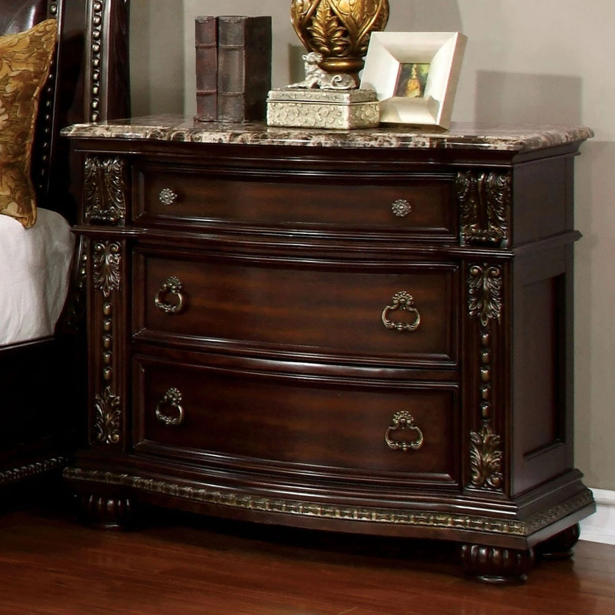 Dark wood nightstand with ornate details and marble top