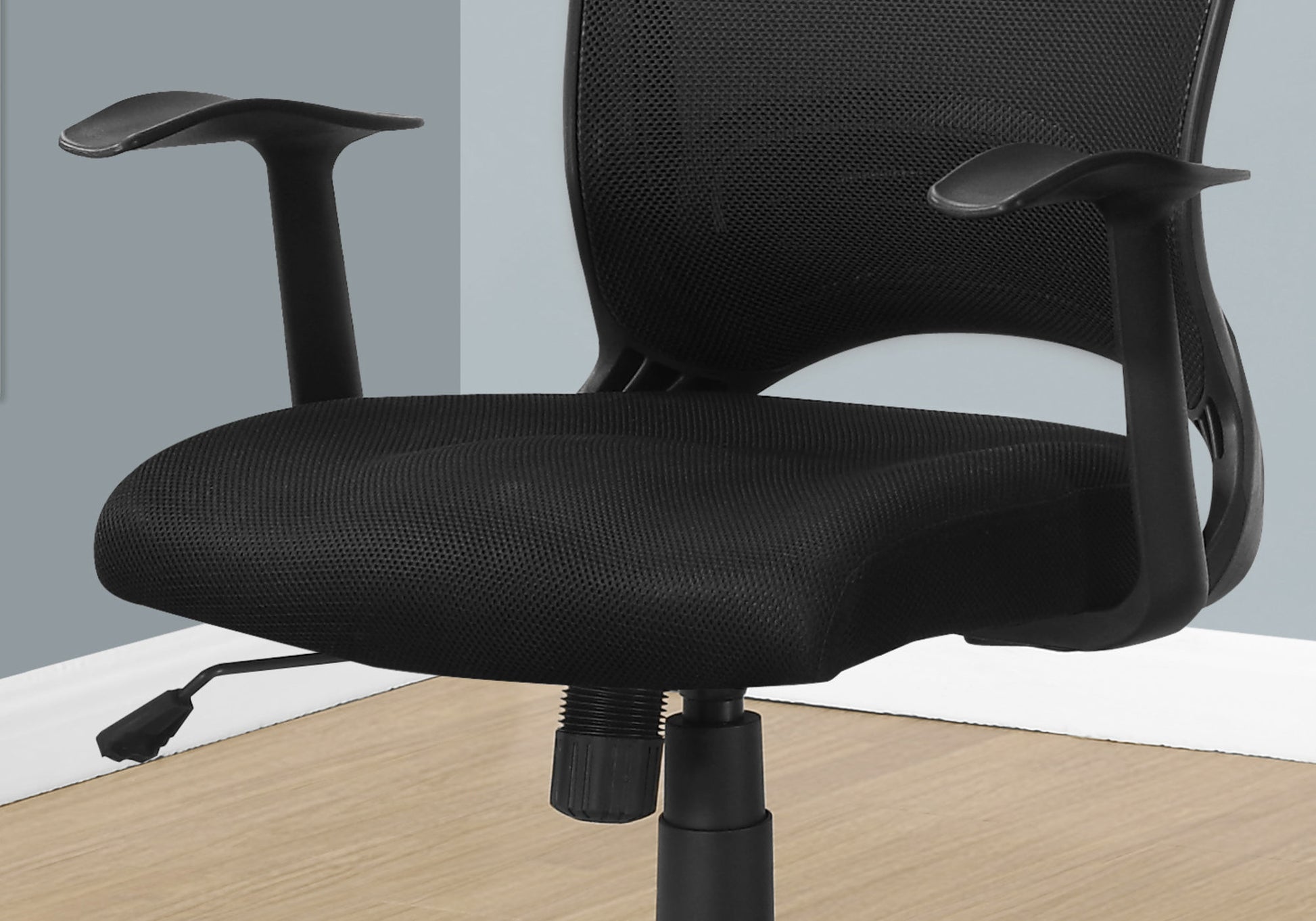 Black mesh office chair with adjustable armrests and padded seat
