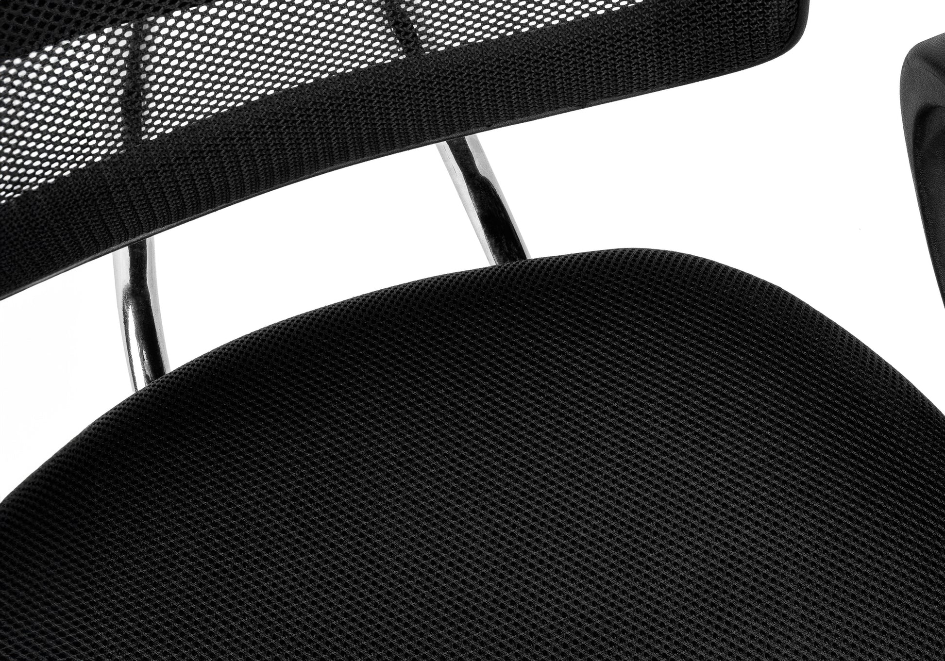 Closeup of black mesh office chair seat fabric with visible weave pattern