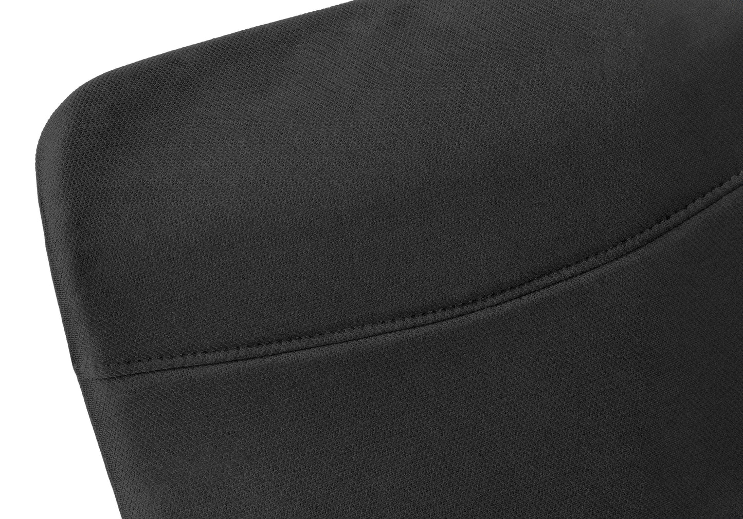 Closeup of black textured fabric with visible stitching on a sleek modern chair