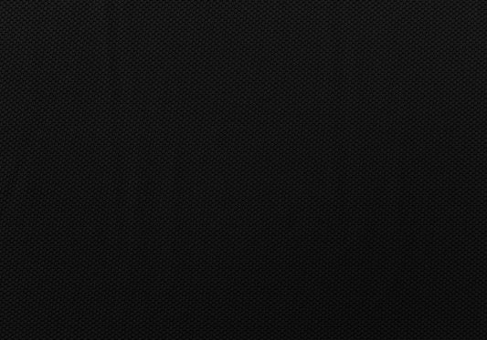 Closeup of black fabric with a subtle hexagonal textured pattern