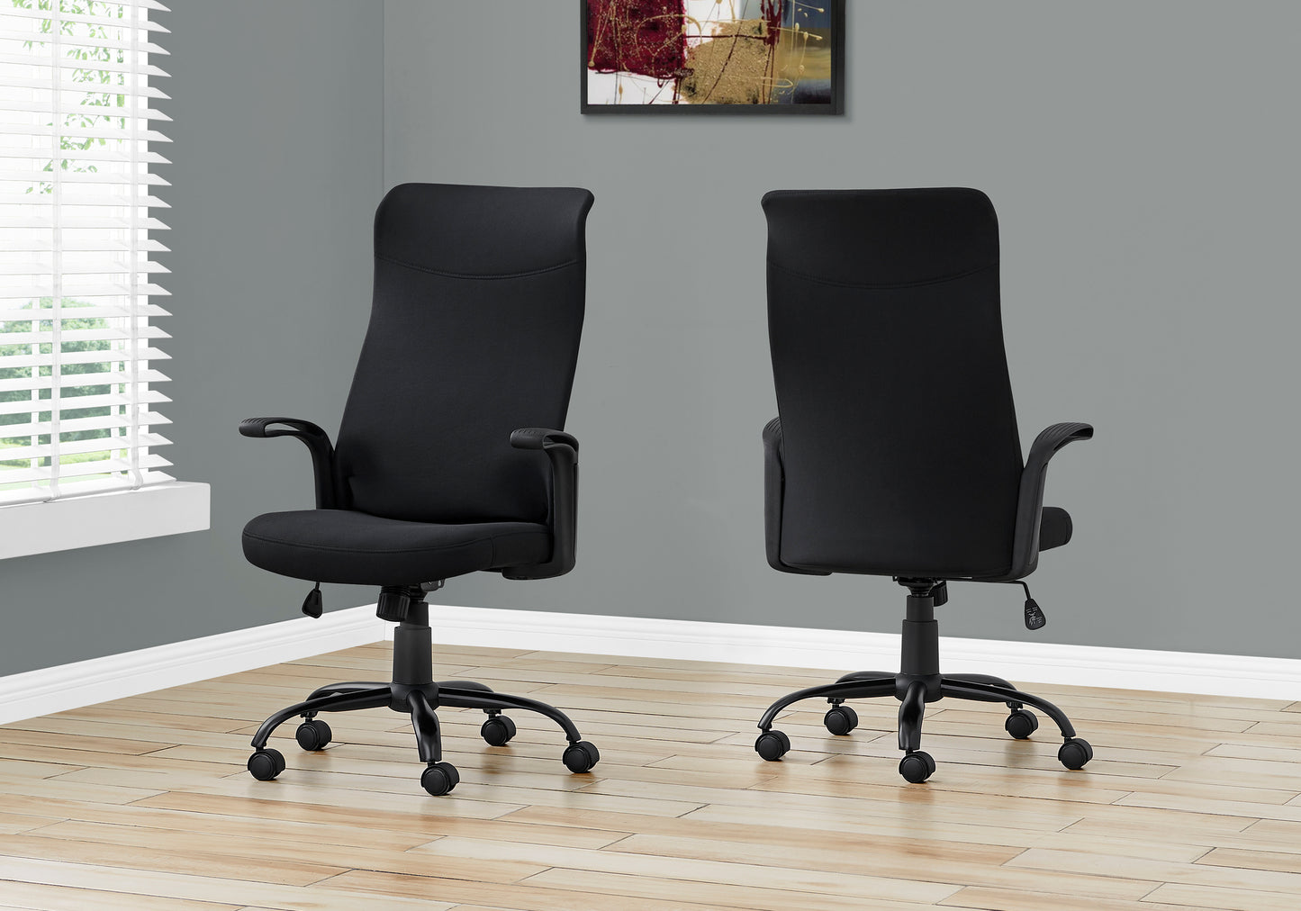 Black fabric executive chair with lumbar support and adjustable height for office use