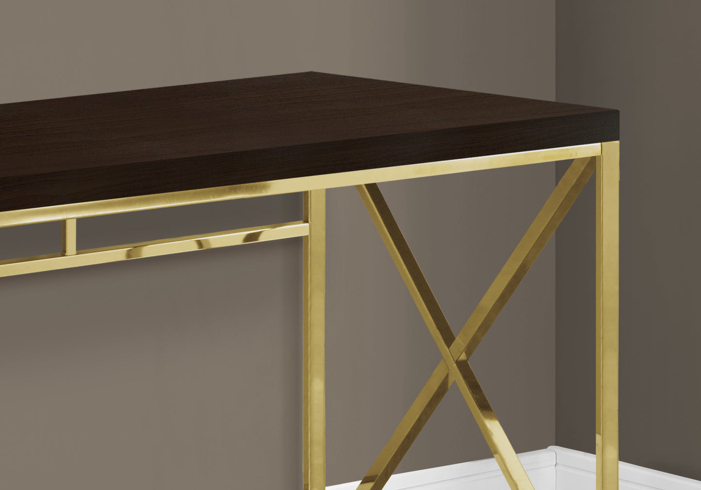 Dark wood desk with brushed gold metal legs and xframe support
