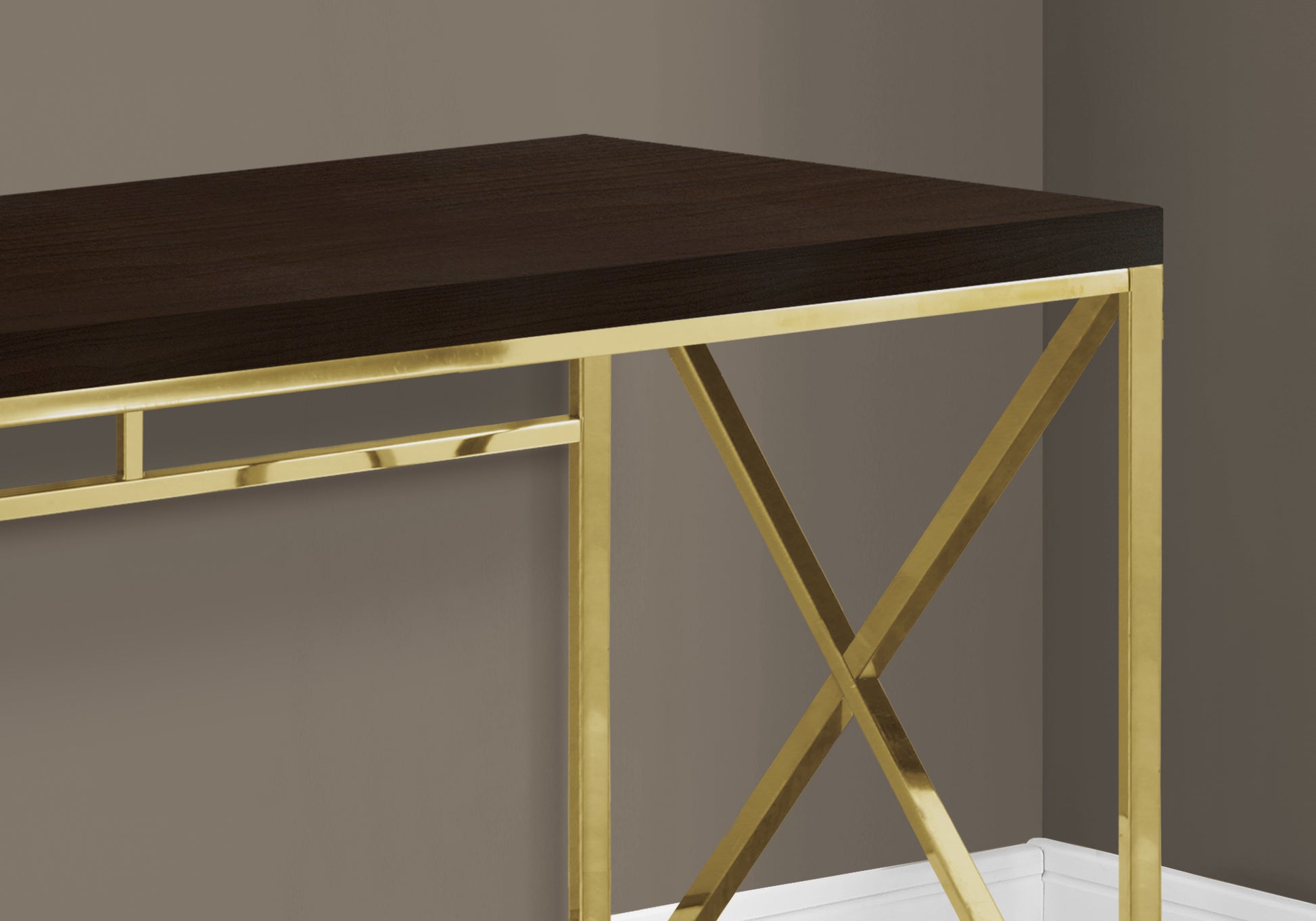 Dark wood desk with brushed gold metal legs and xframe support