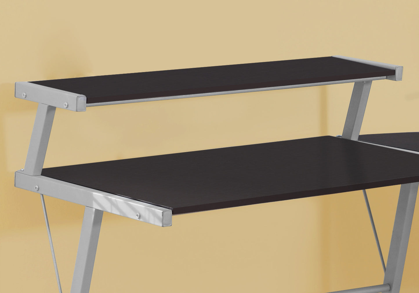 Dark wood computer desk with silver metal frame and dual shelves