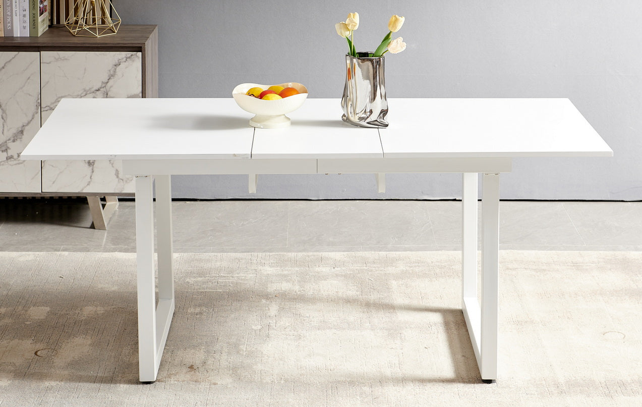 Modern white extendable dining table with sleek metal legs for contemporary kitchens