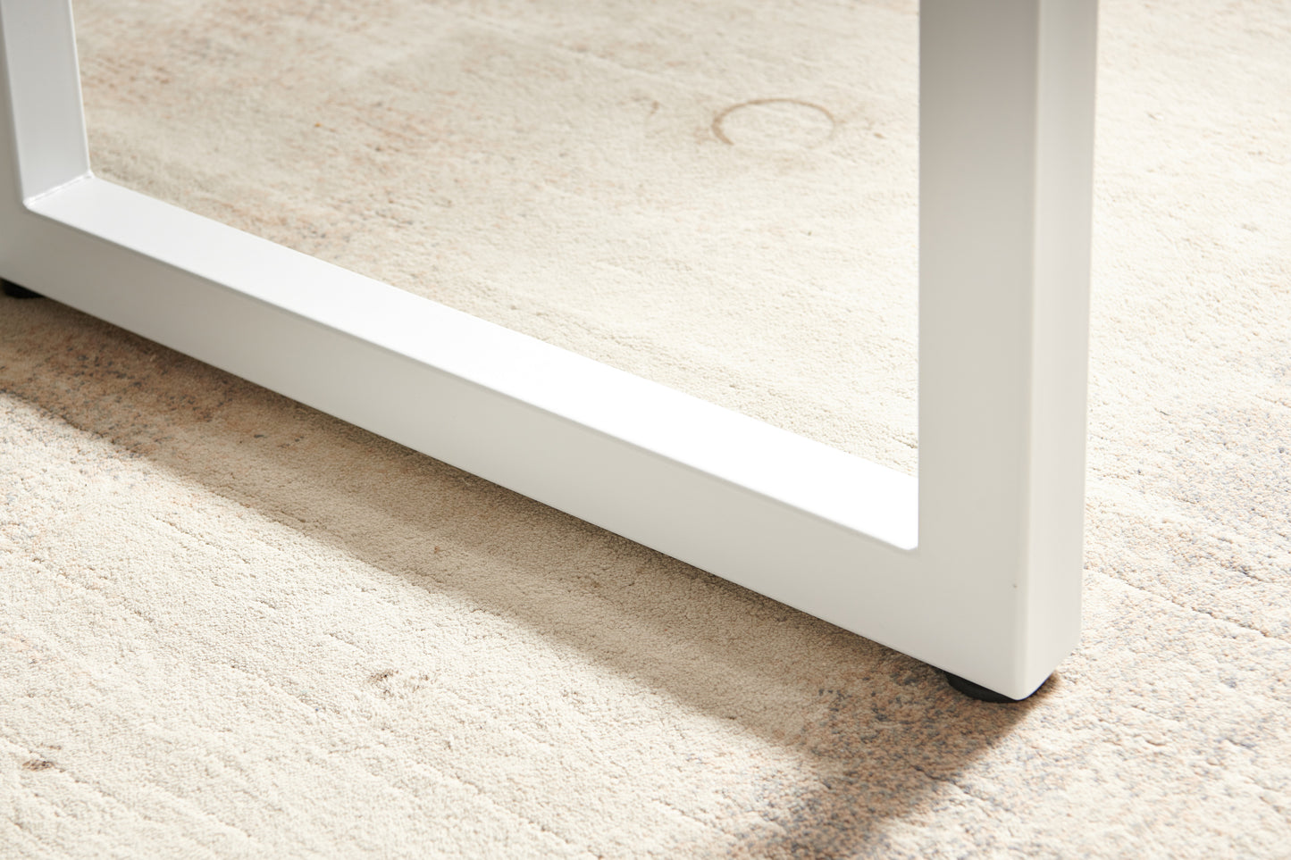 White metal table leg with clean lines showcasing modern furniture design