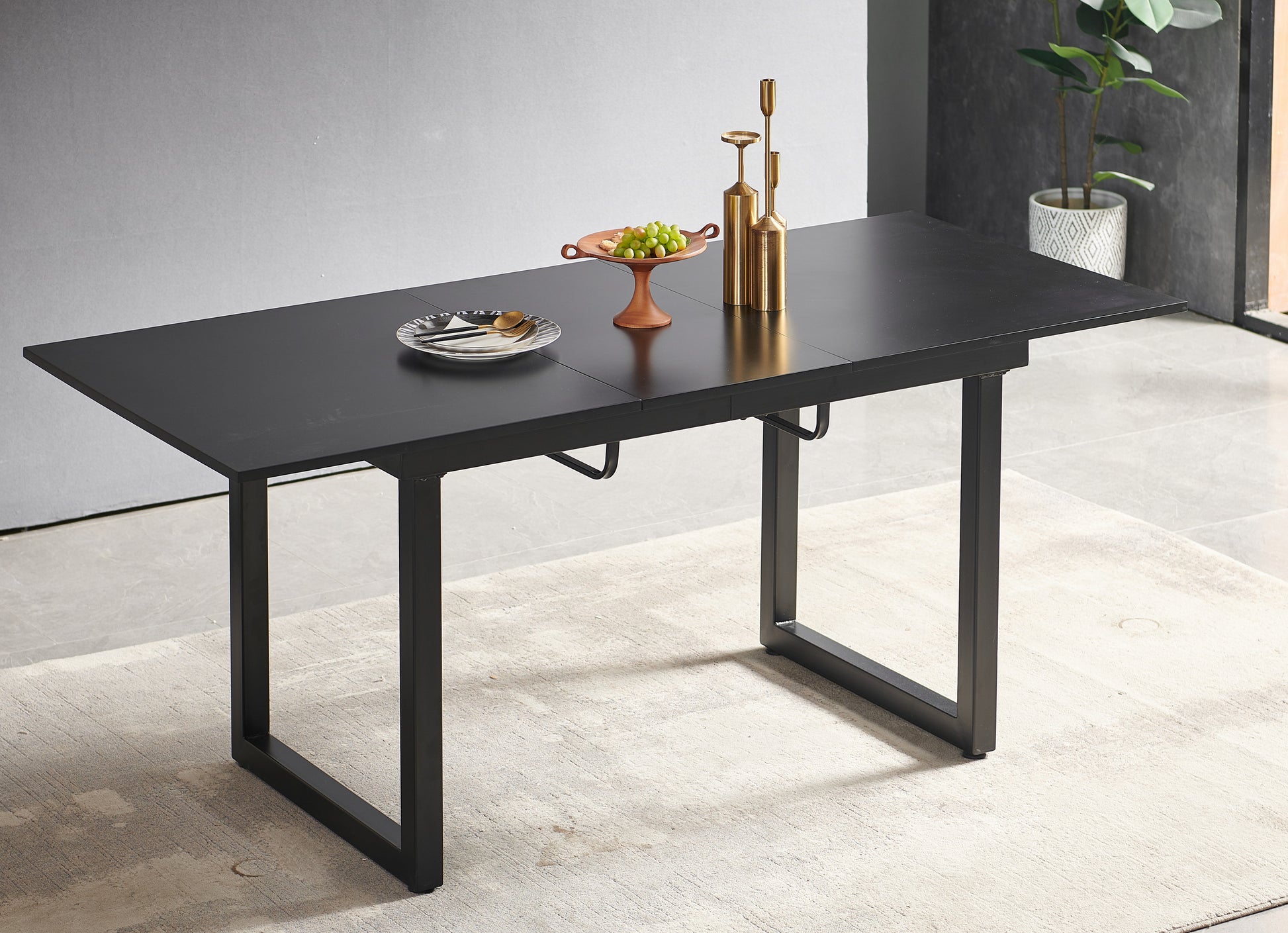 Sleek black extendable dining table with modern metal legs perfect for contemporary homes