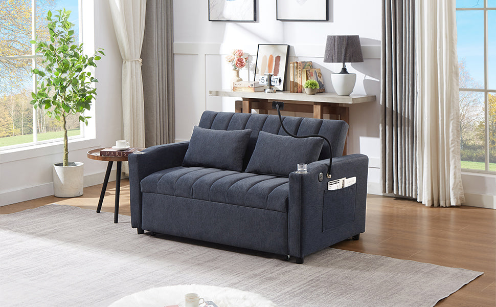 Dark gray upholstered sleeper sofa with channeled back and integrated storage pockets perfect for small spaces