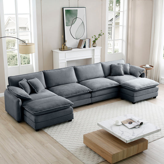 Plush grey corduroy sectional sofa with multiple cushions and chaise lounge for comfortable seating