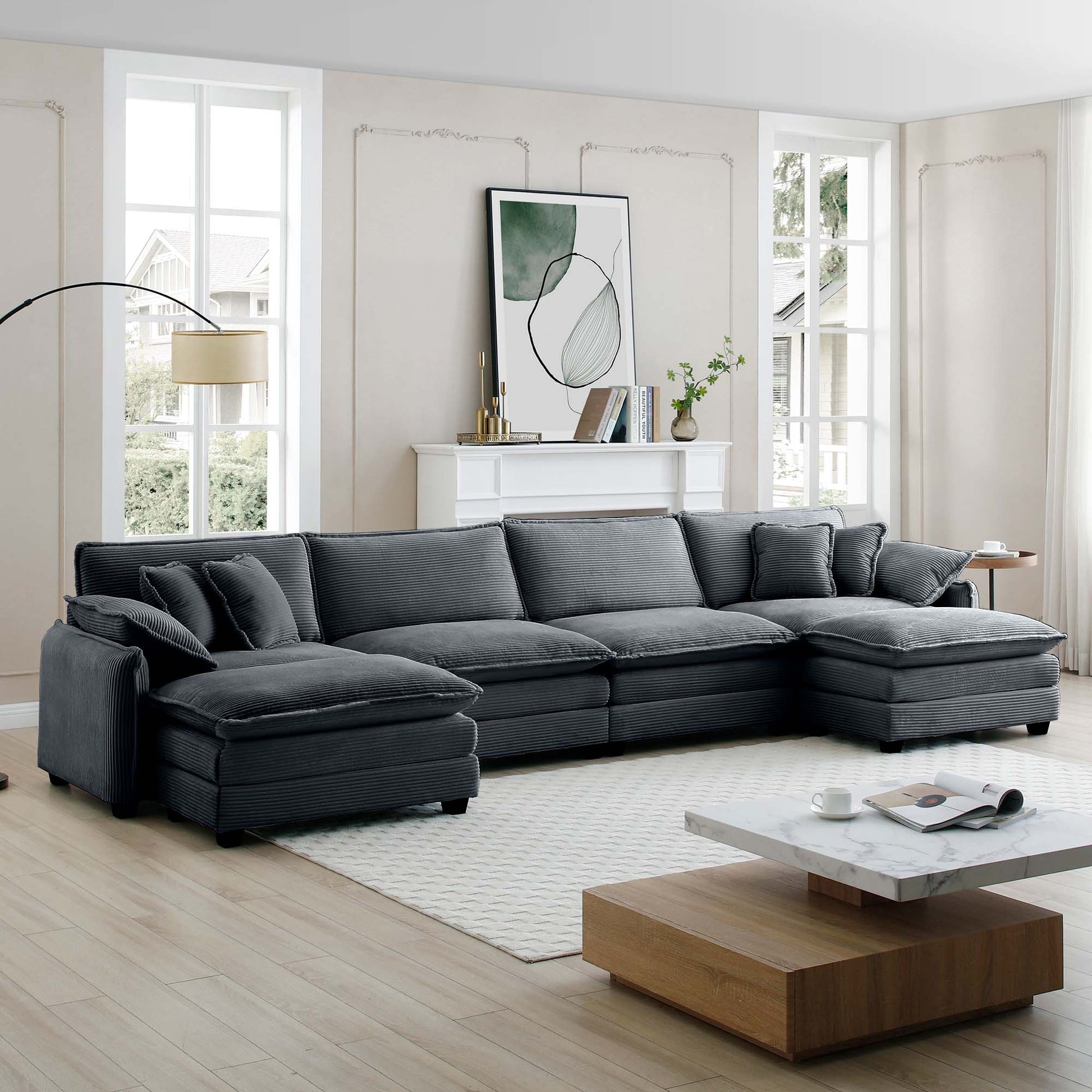 Deep charcoal corduroy sectional sofa with plush pillows modern living room design