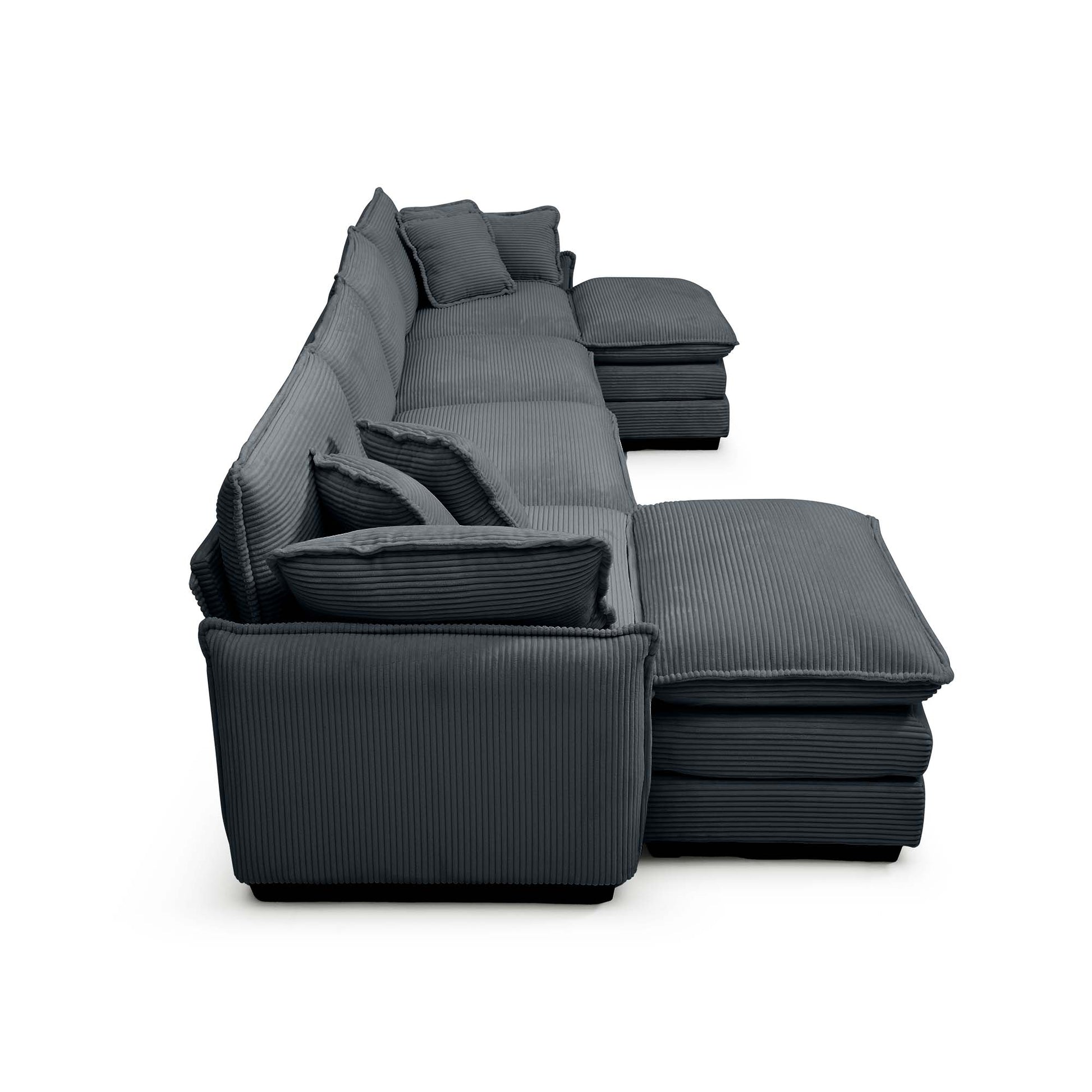 Dark gray corduroy sectional sofa with plush cushions and an ottoman perfect for modern living rooms