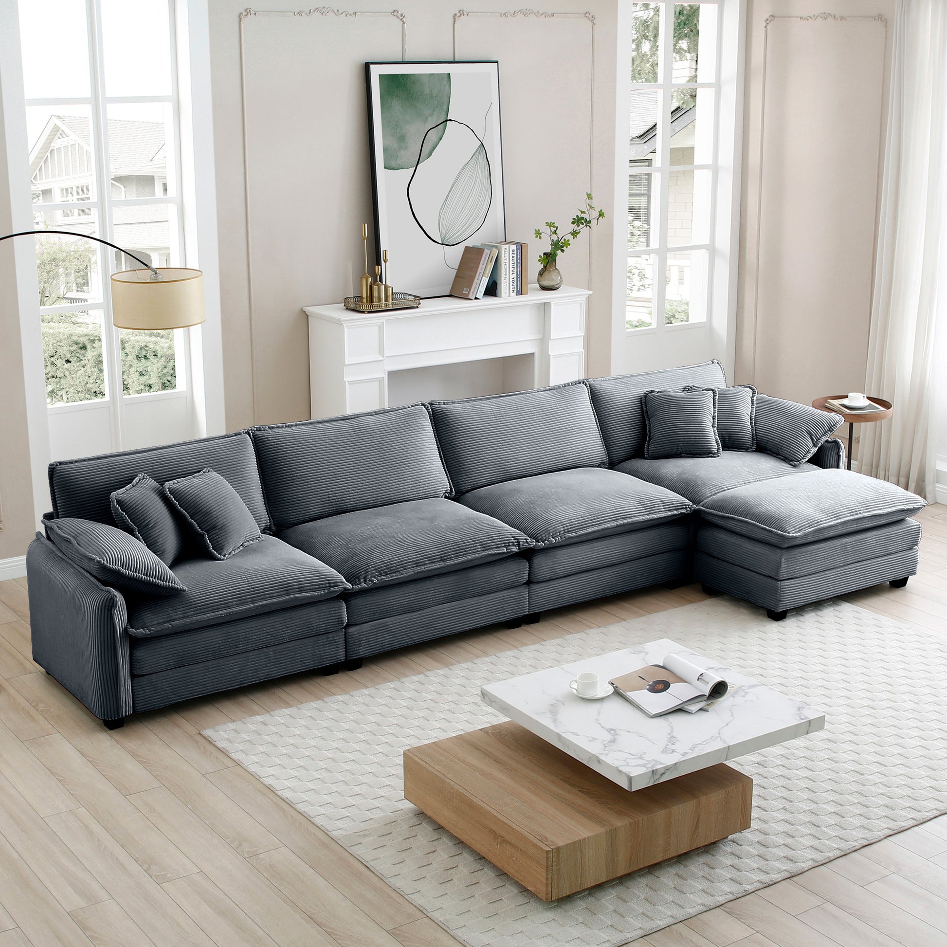 Plush charcoal gray corduroy sectional sofa with deep cushions and multiple throw pillows perfect for a modern living room